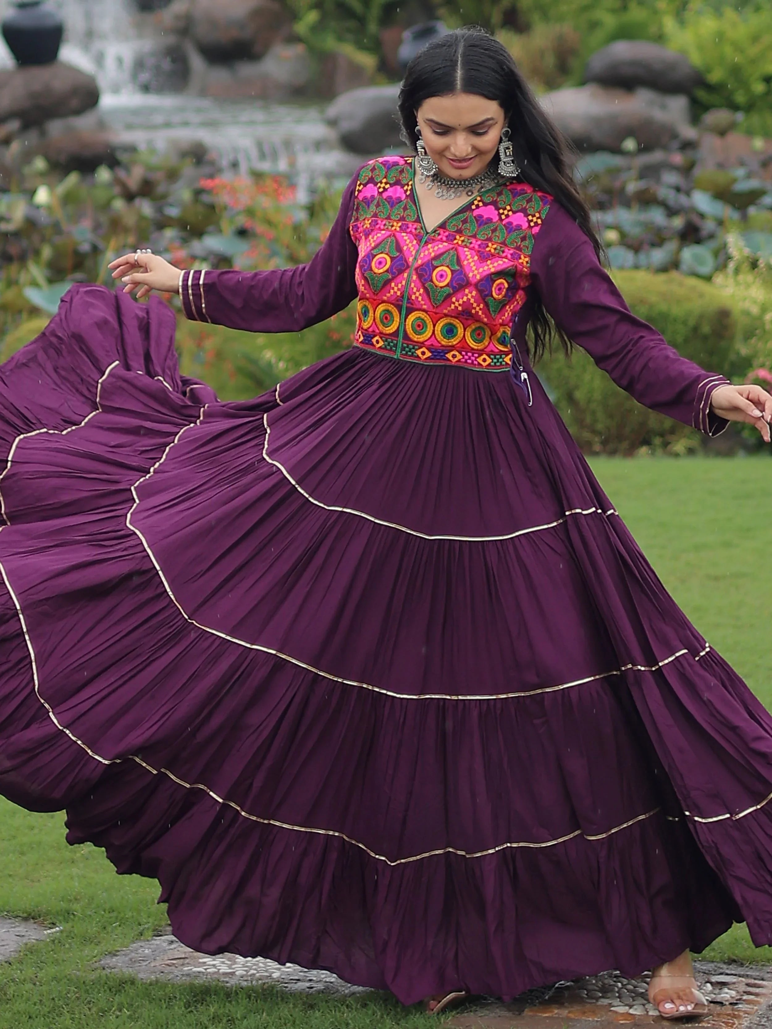 Wine coloured rayon flair gown with kutchi gamthi embroidery and mirror work