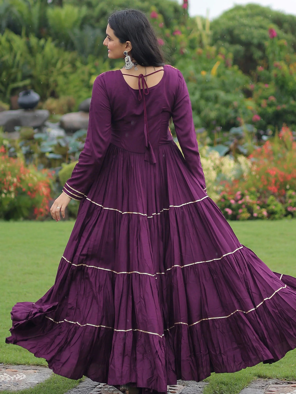 Wine coloured rayon flair gown with kutchi gamthi embroidery and mirror work