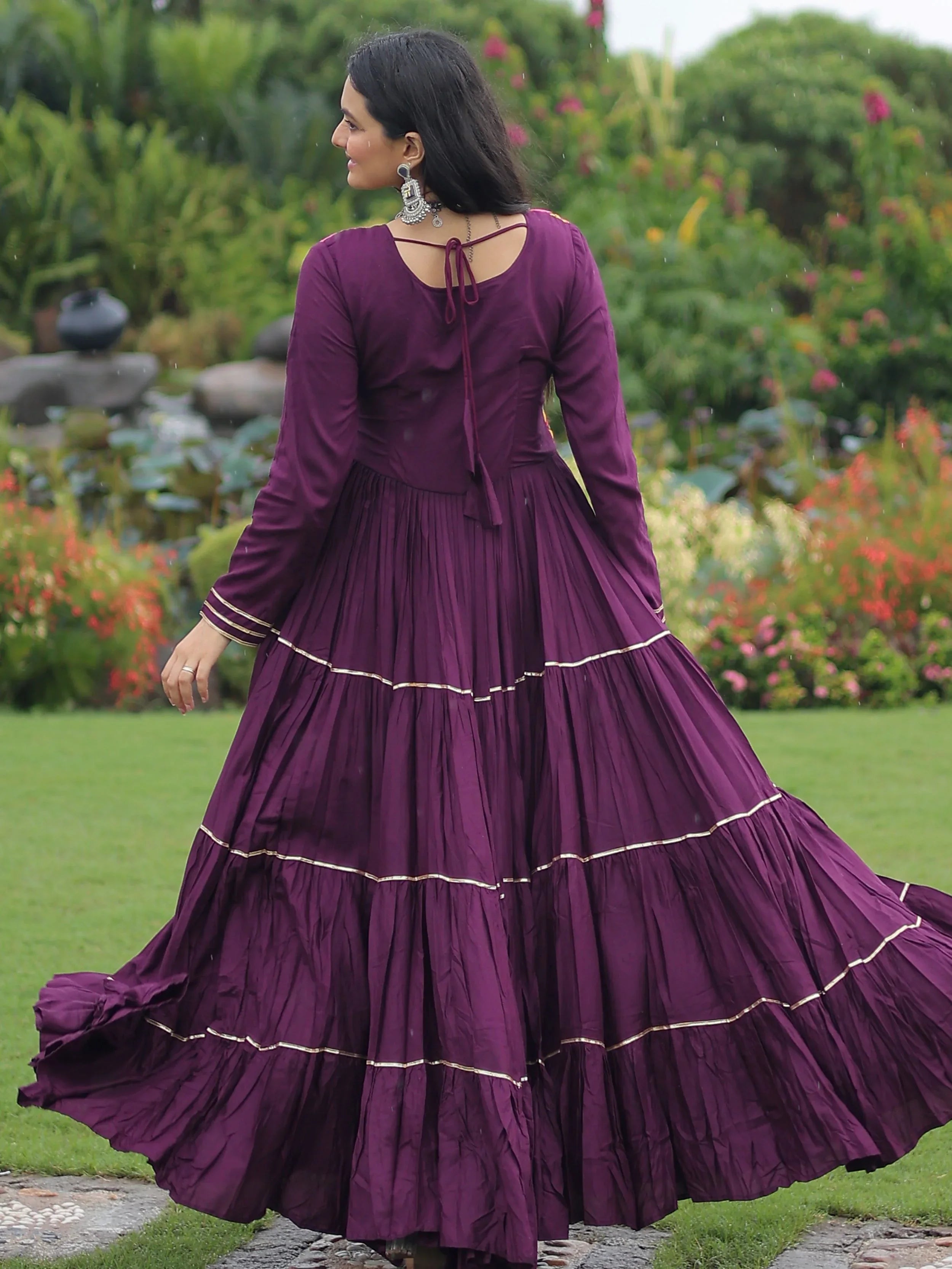 Wine coloured rayon flair gown with kutchi gamthi embroidery and mirror work