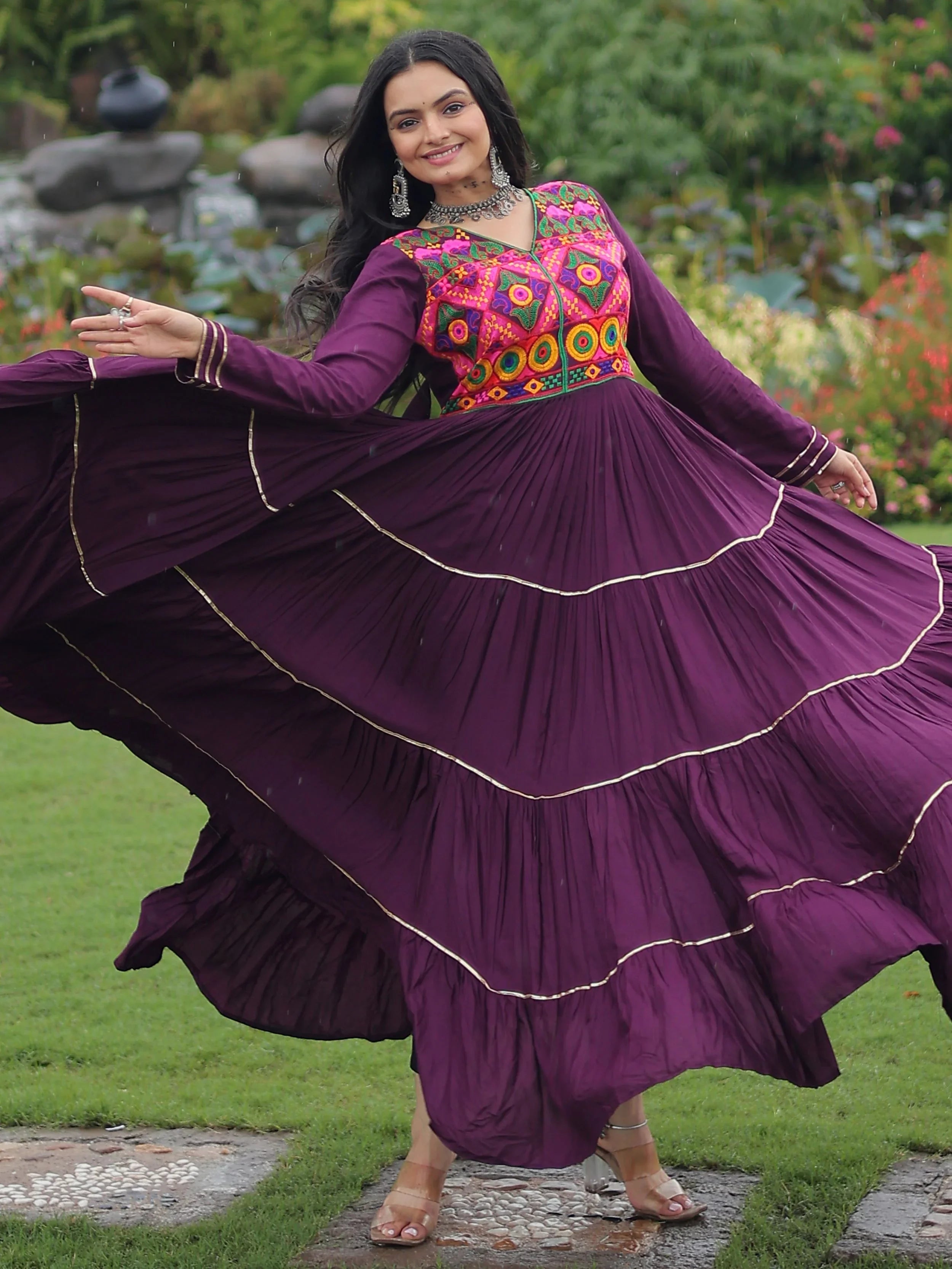 Wine coloured rayon flair gown with kutchi gamthi embroidery and mirror work