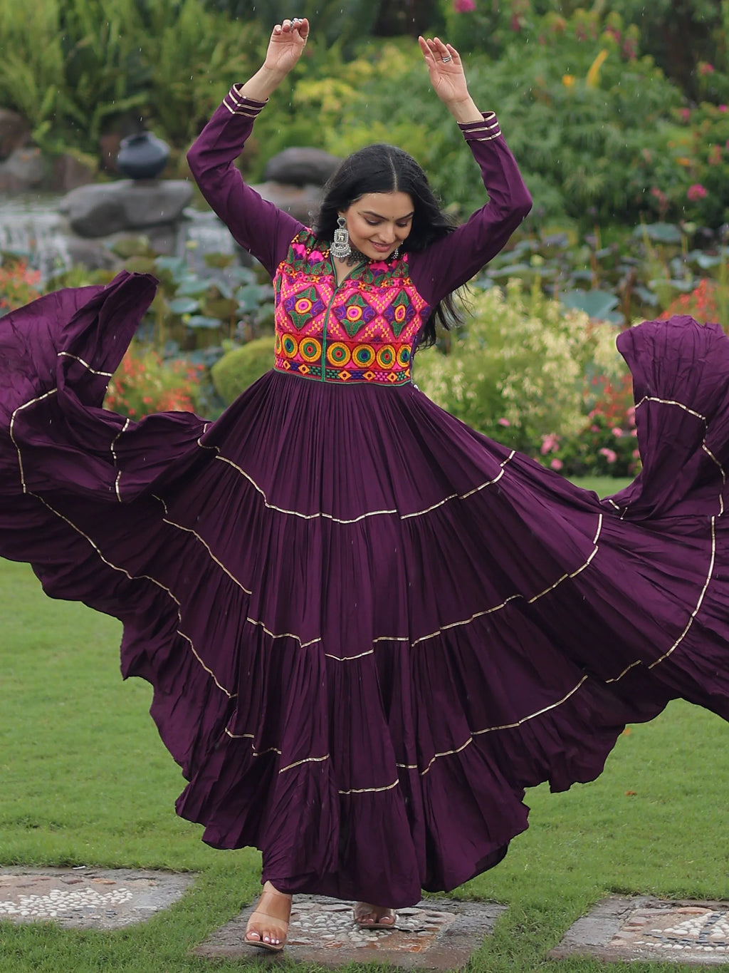 Wine coloured rayon flair gown with kutchi gamthi embroidery and mirror work