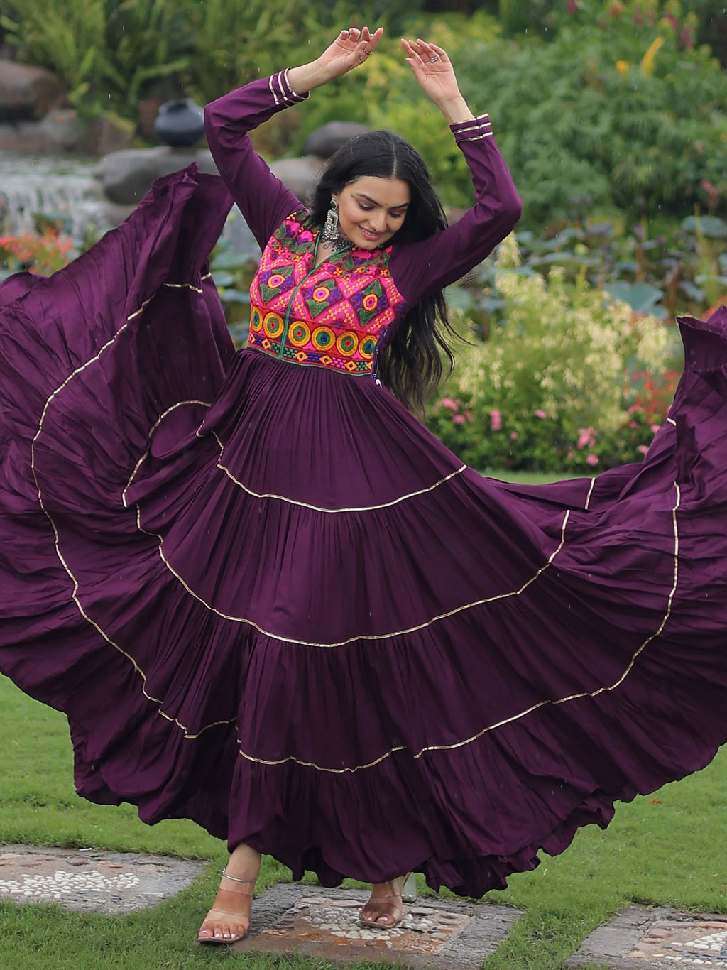 Wine coloured rayon flair gown with kutchi gamthi embroidery and mirror work