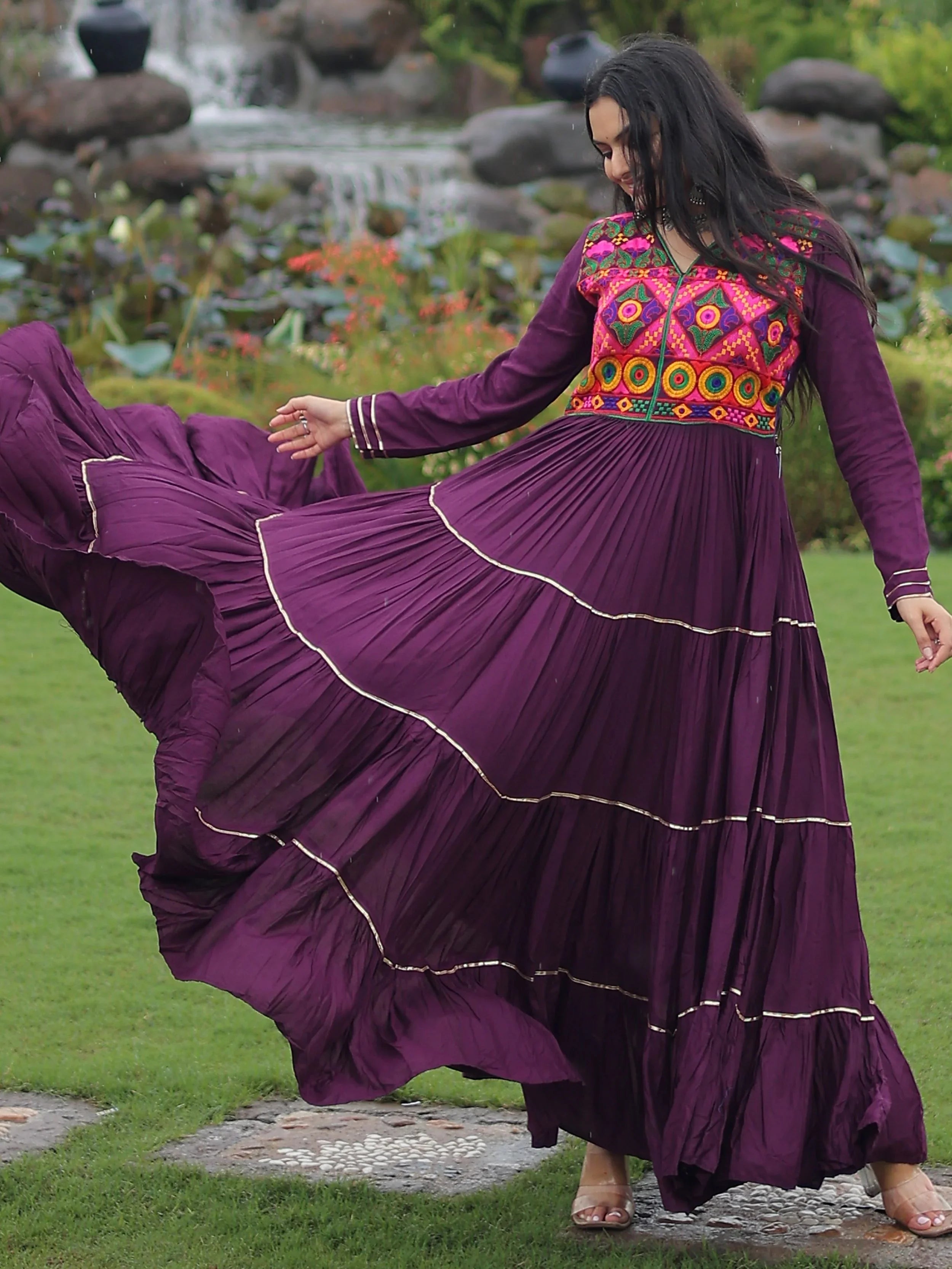 Wine coloured rayon flair gown with kutchi gamthi embroidery and mirror work