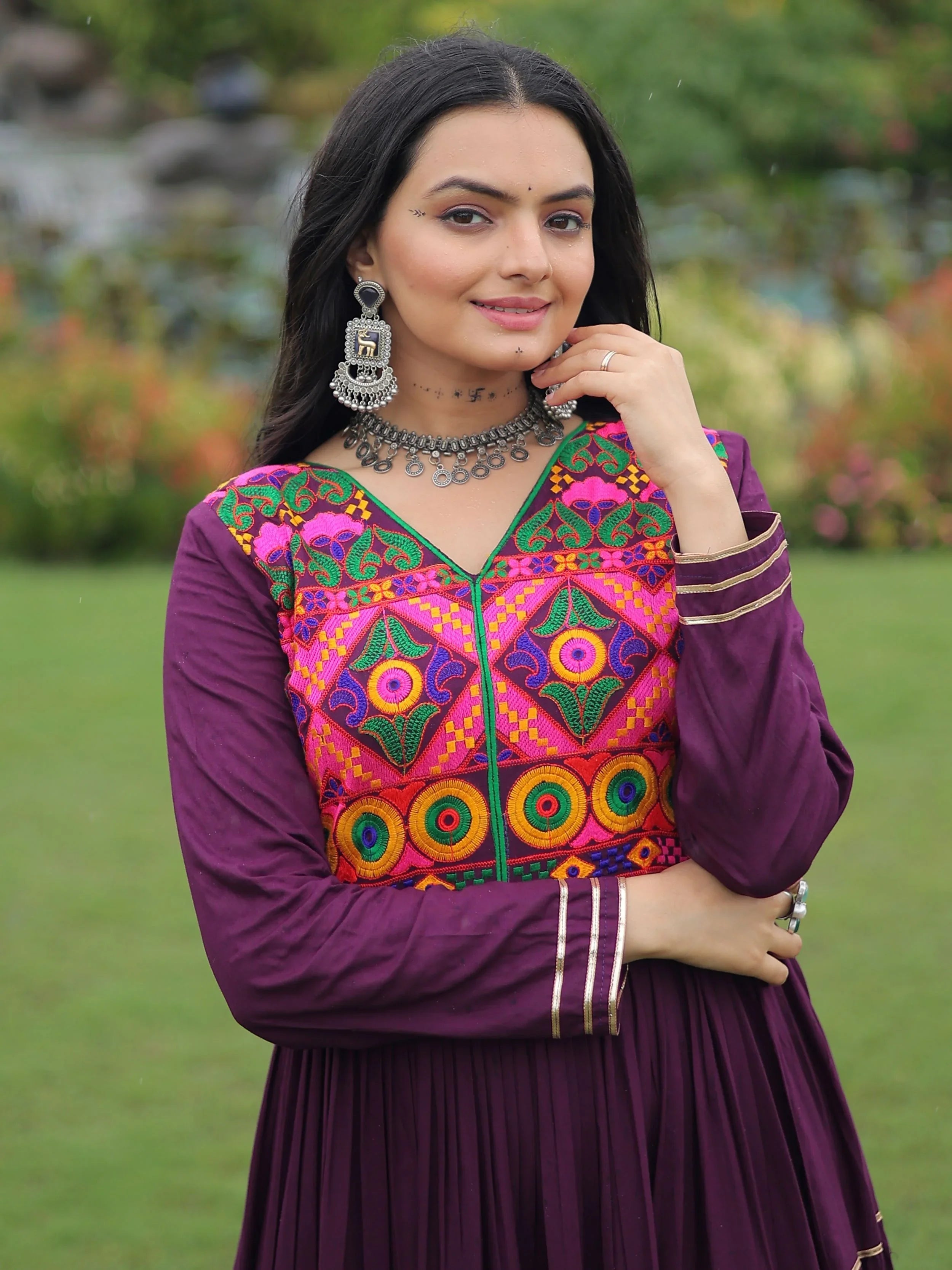 Wine coloured rayon flair gown with kutchi gamthi embroidery and mirror work