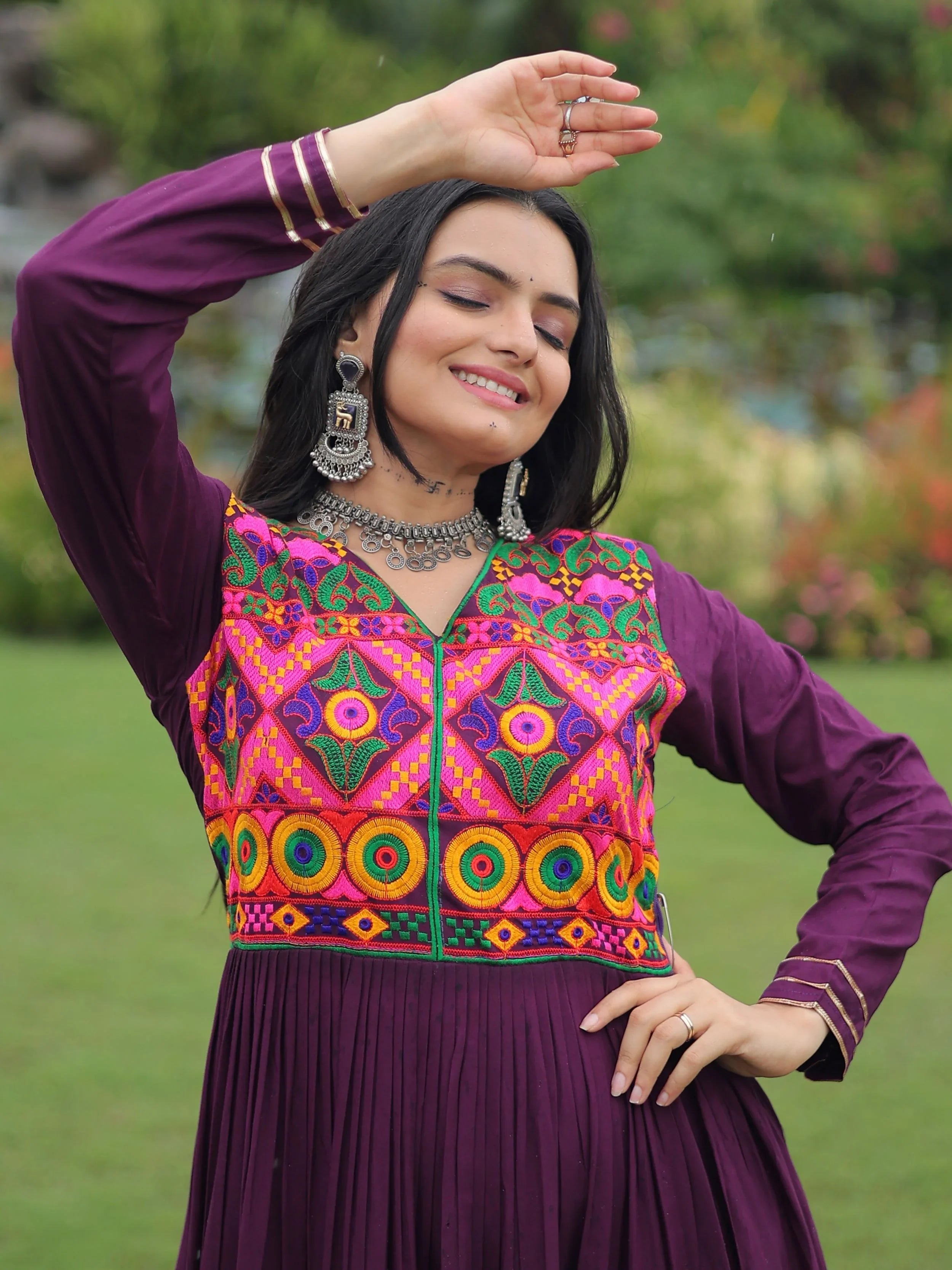 Wine coloured rayon flair gown with kutchi gamthi embroidery and mirror work