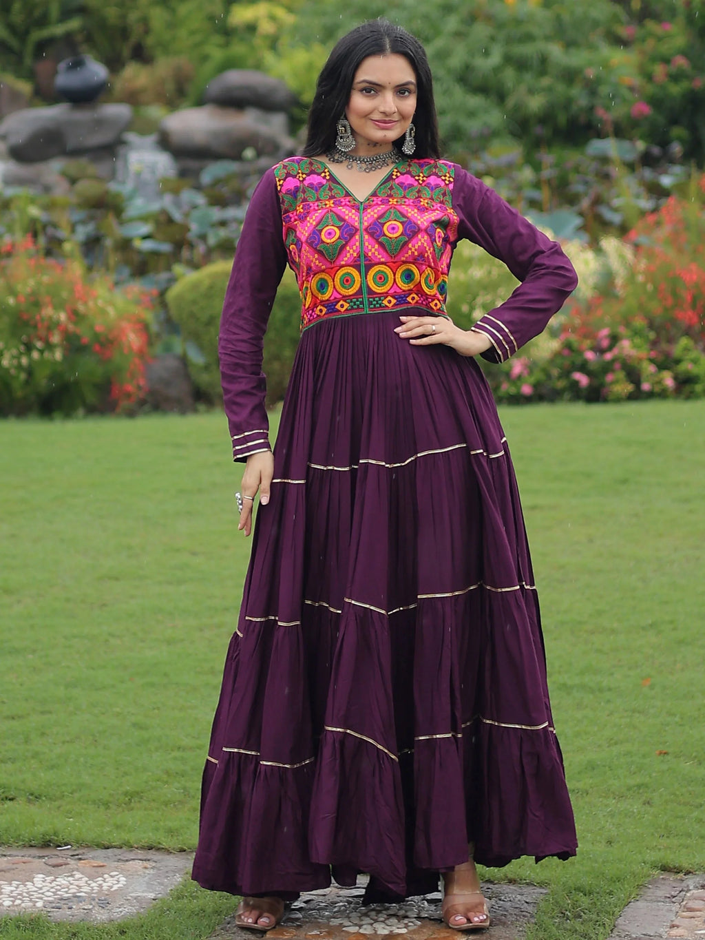 Wine coloured rayon flair gown with kutchi gamthi embroidery and mirror work