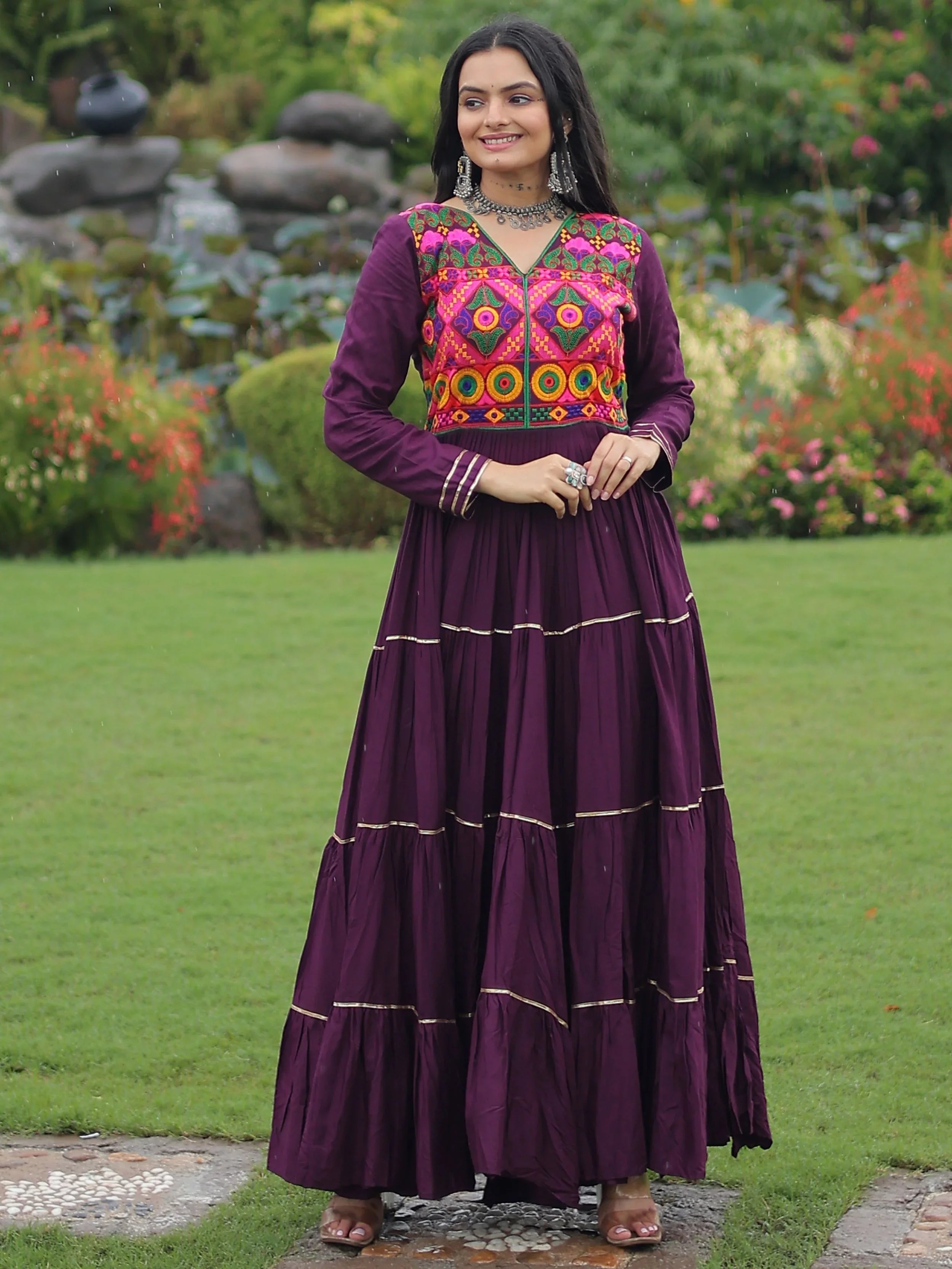 Wine coloured rayon flair gown with kutchi gamthi embroidery and mirror work