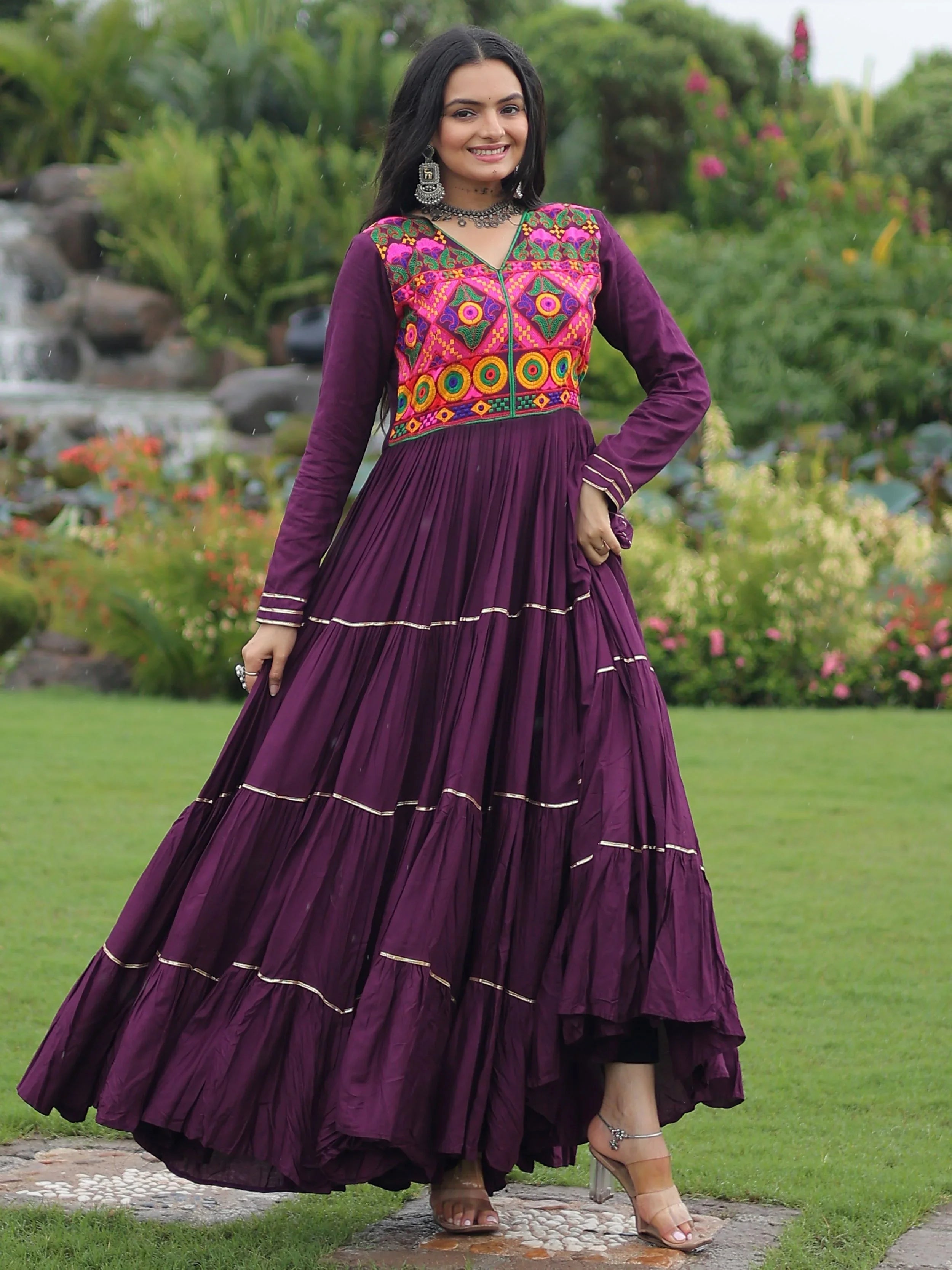 Wine coloured rayon flair gown with kutchi gamthi embroidery and mirror work