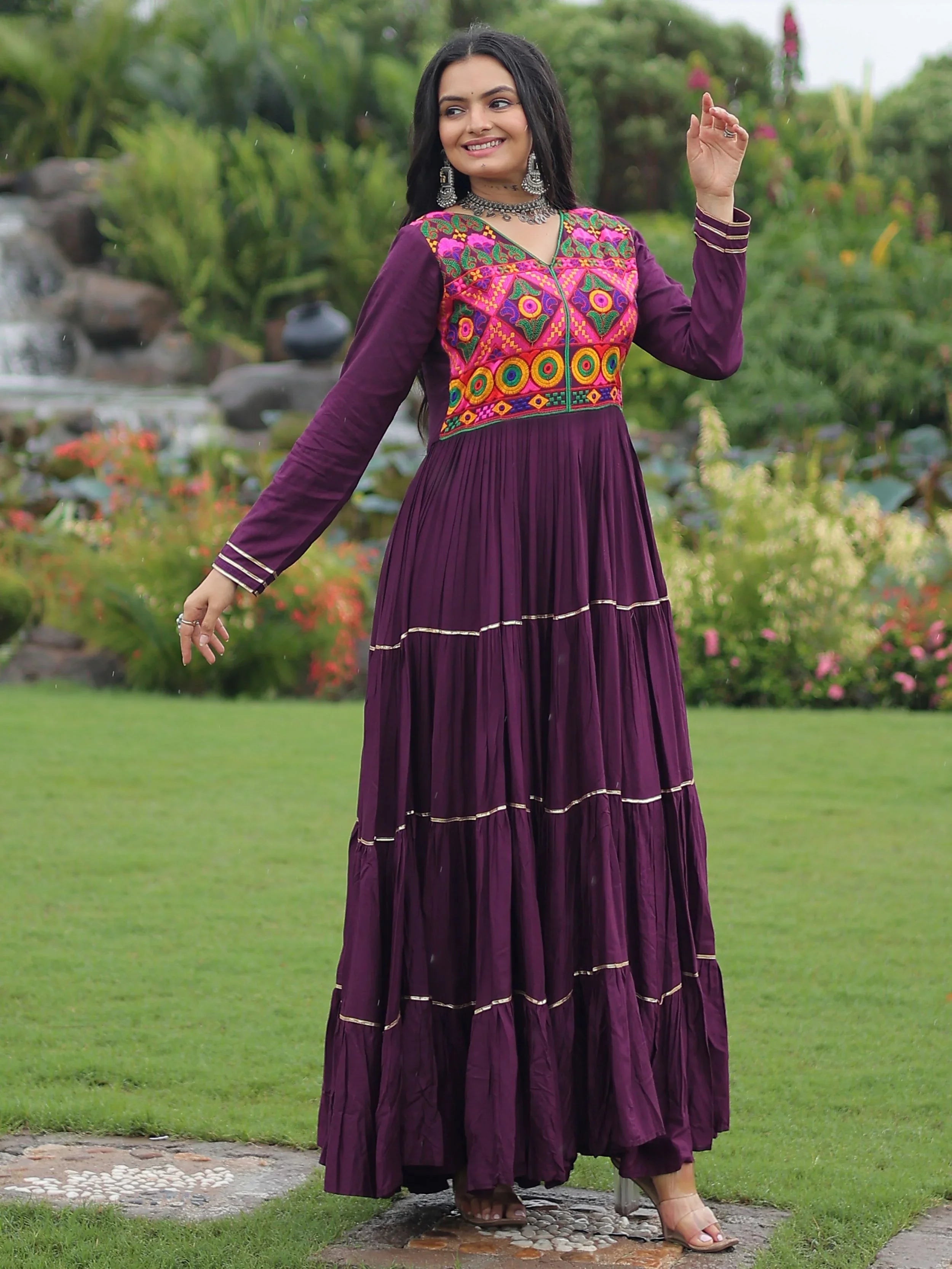 Wine coloured rayon flair gown with kutchi gamthi embroidery and mirror work