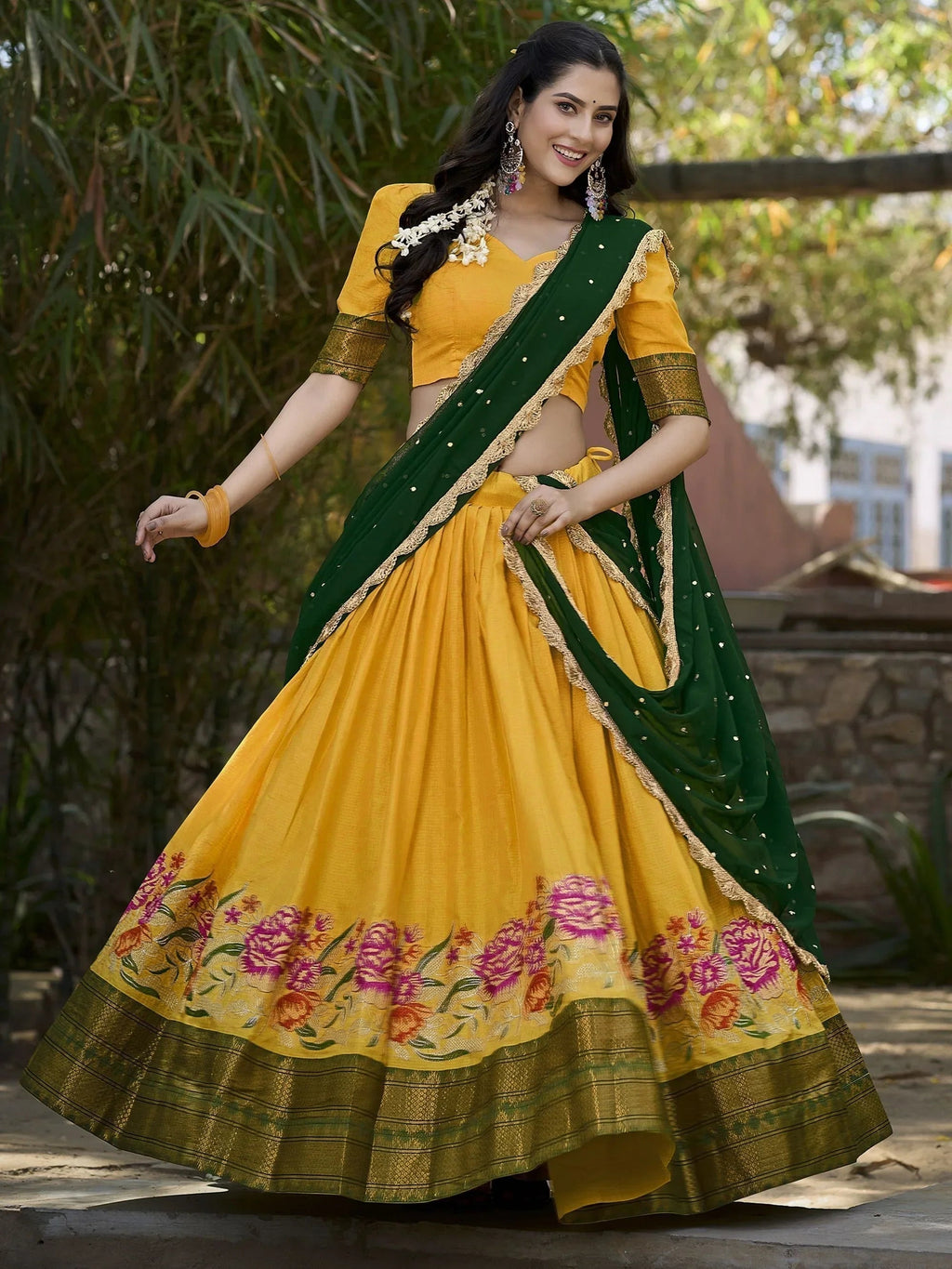 Elegant yellow cotton silk lehenga choli set with intricate embroidery and dupatta