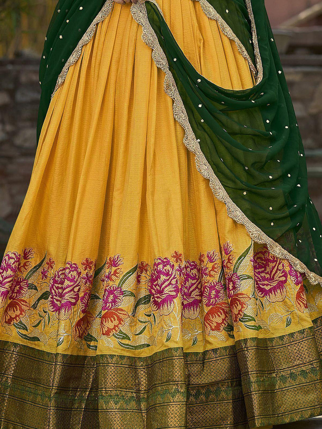 Elegant yellow cotton silk lehenga choli set with intricate embroidery and dupatta