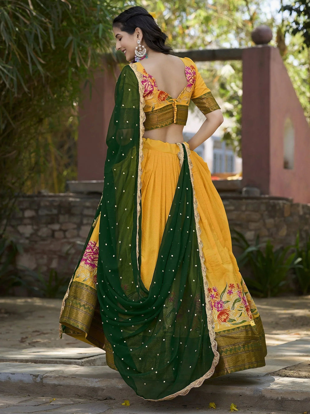 Elegant yellow cotton silk lehenga choli set with intricate embroidery and dupatta