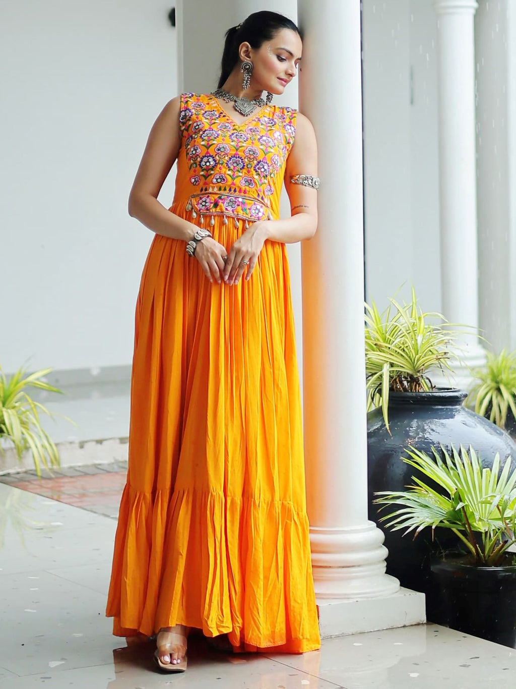 Yellow rayon sleeveless gown with kutchi gamthi embroidery and mirror work