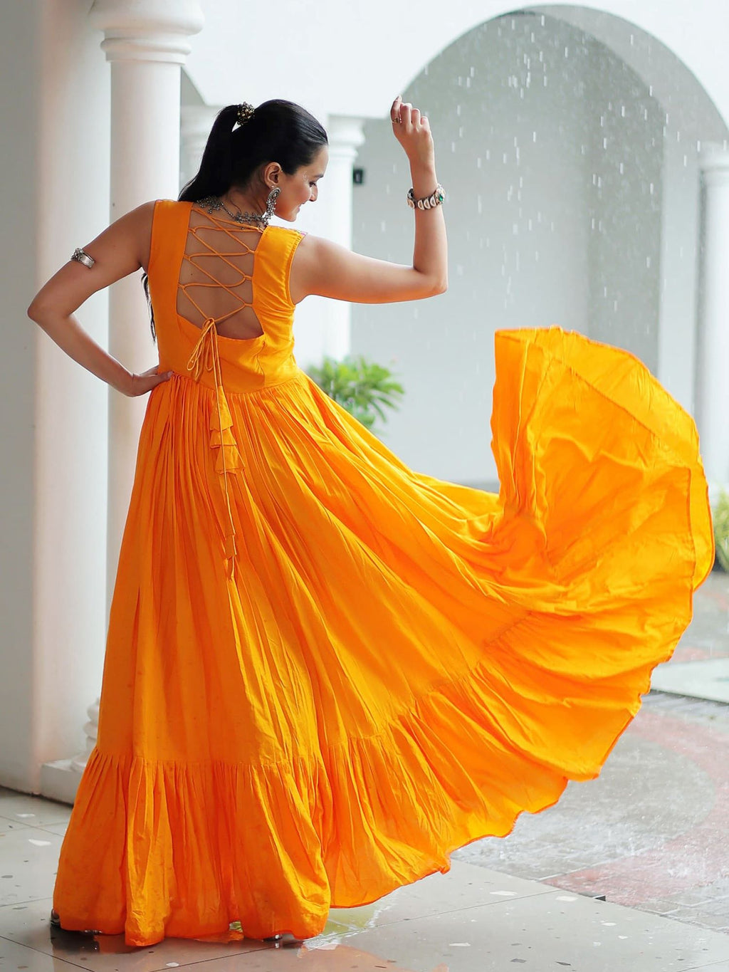 Yellow rayon sleeveless gown with kutchi gamthi embroidery and mirror work