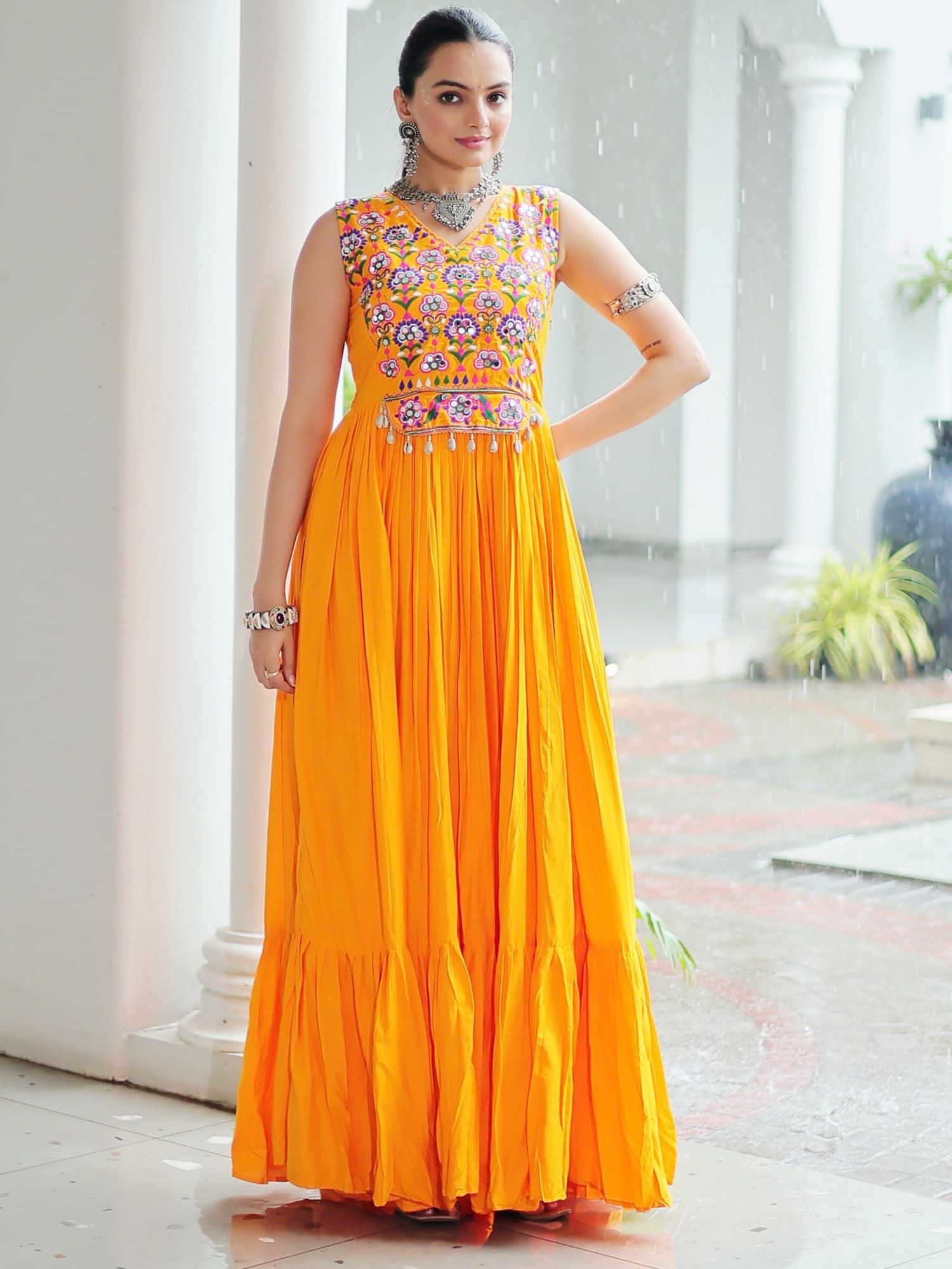 Yellow rayon sleeveless gown with kutchi gamthi embroidery and mirror work