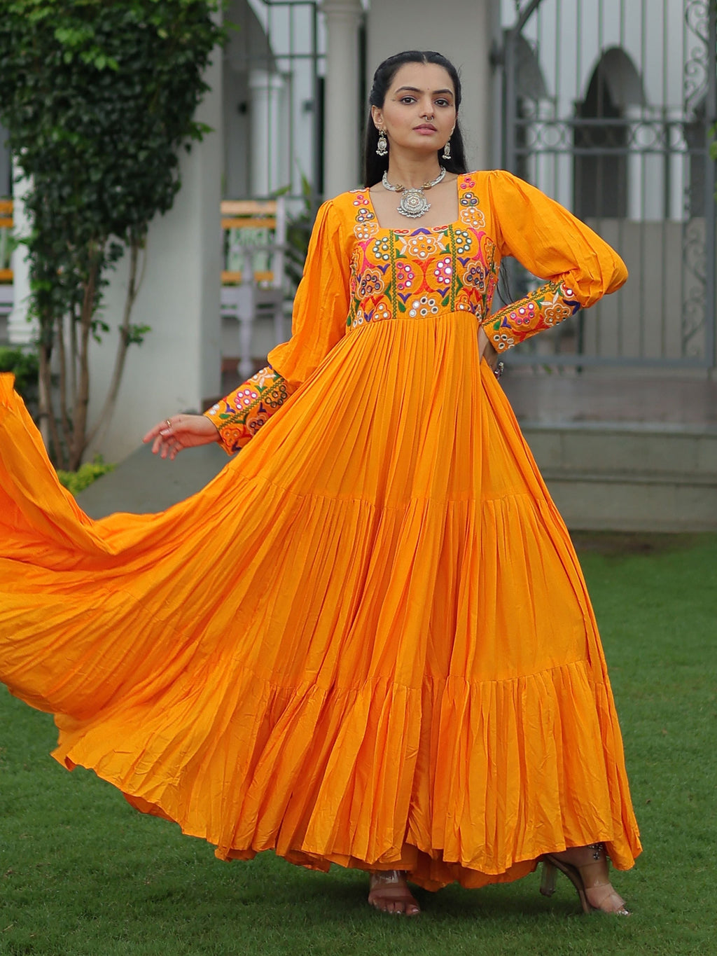 Yellow rayon flair gown with kutchi gamthi work for navratri