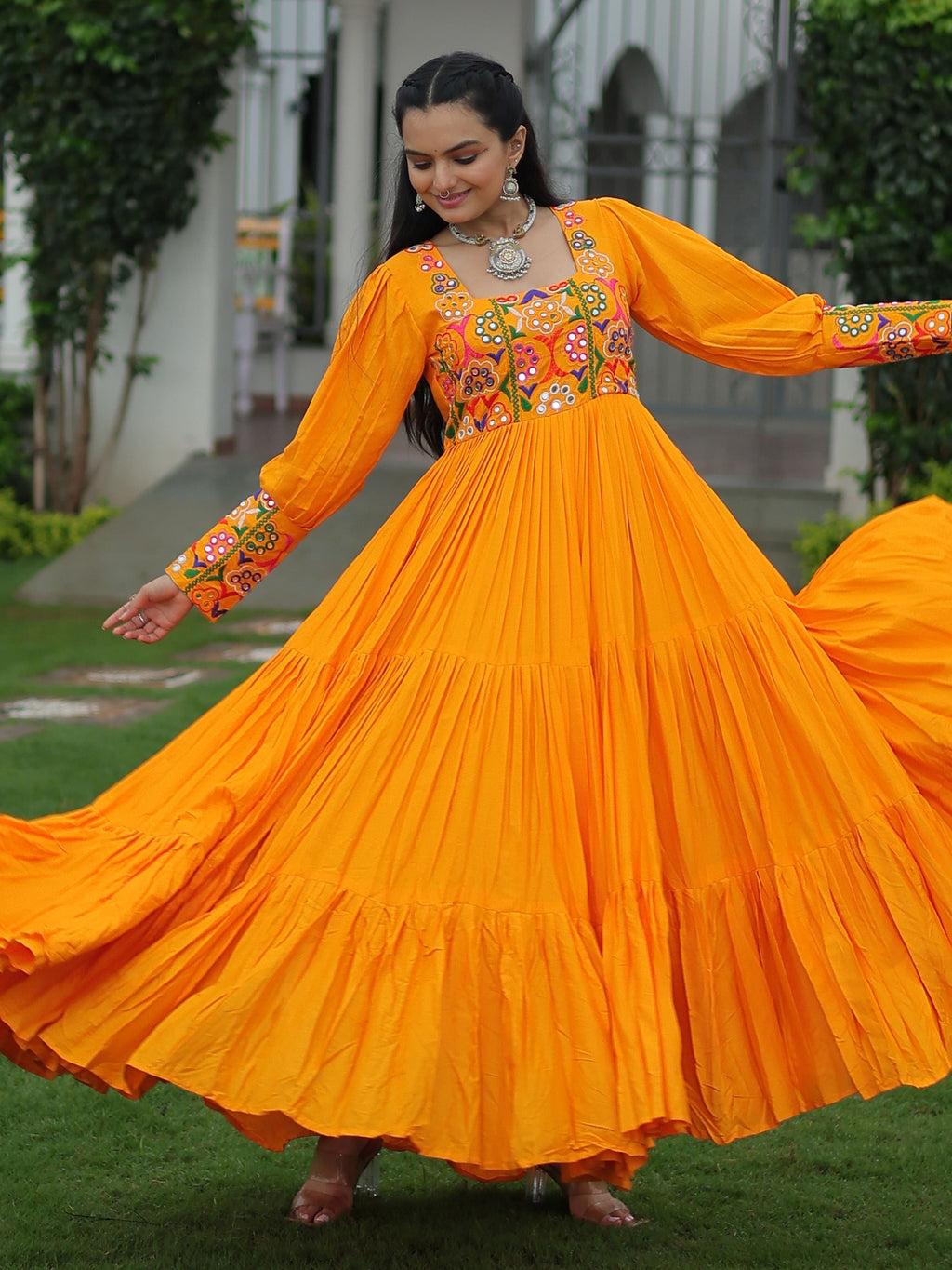 Yellow rayon flair gown with kutchi gamthi work for navratri