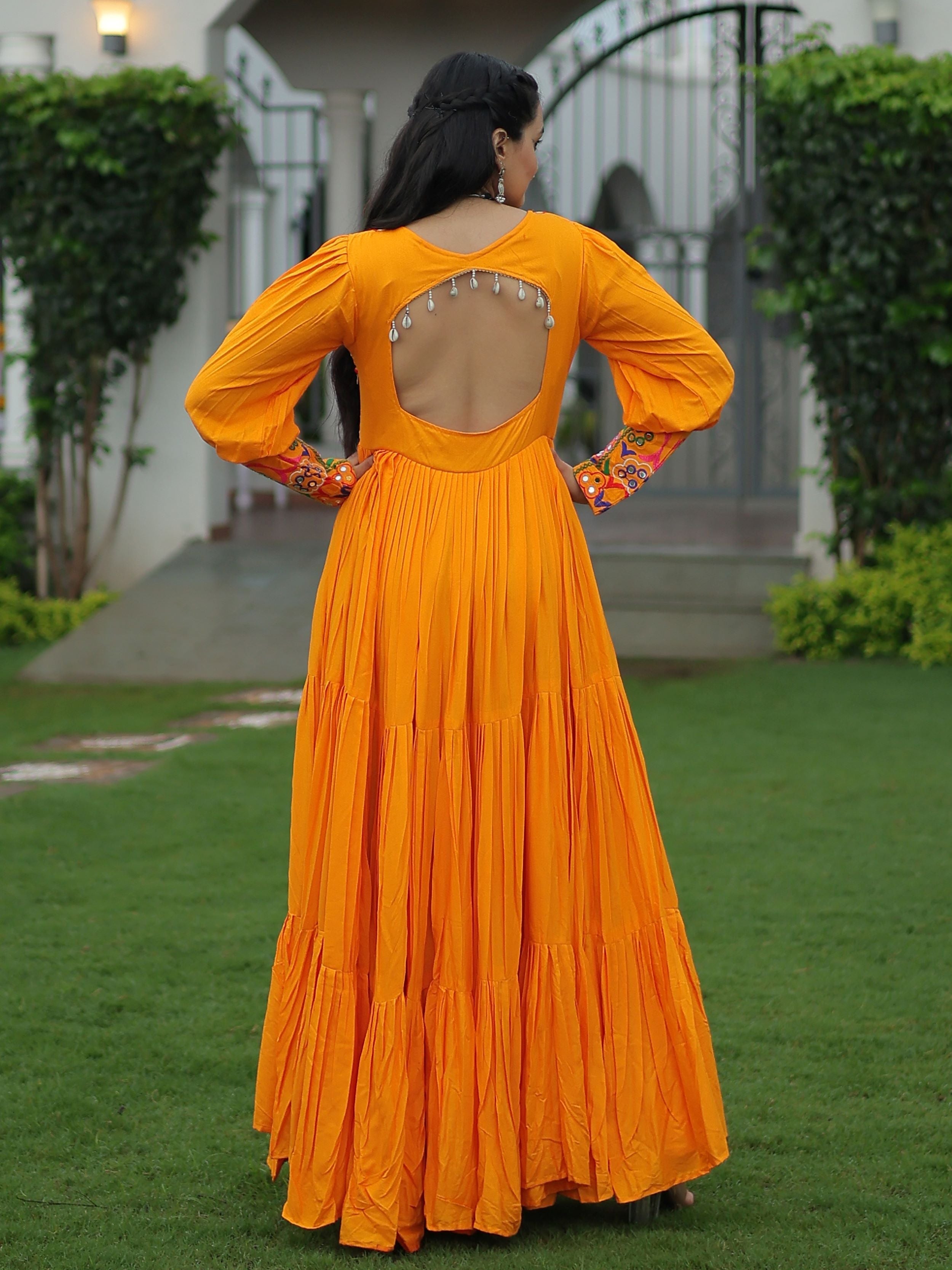 Yellow rayon flair gown with kutchi gamthi work for navratri