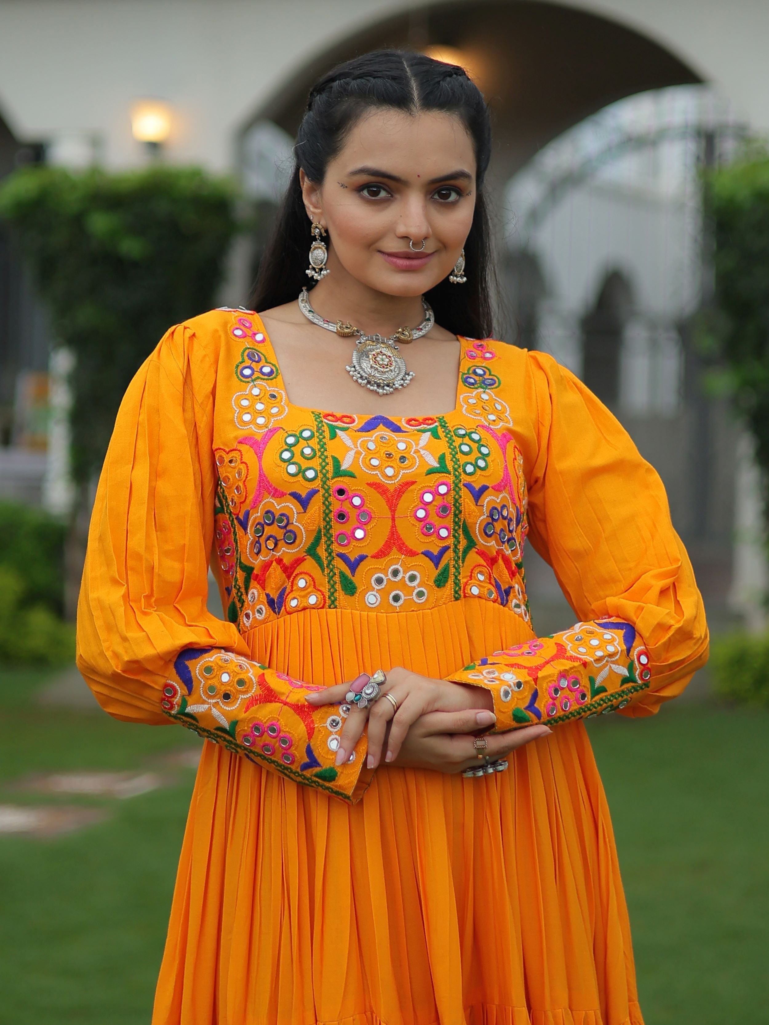 Yellow rayon flair gown with kutchi gamthi work for navratri