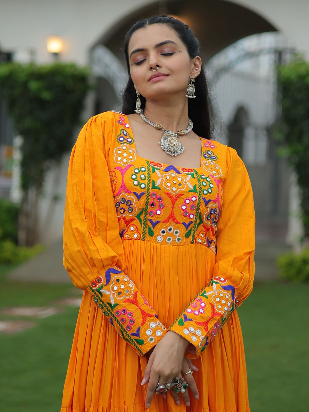 Yellow rayon flair gown with kutchi gamthi work for navratri