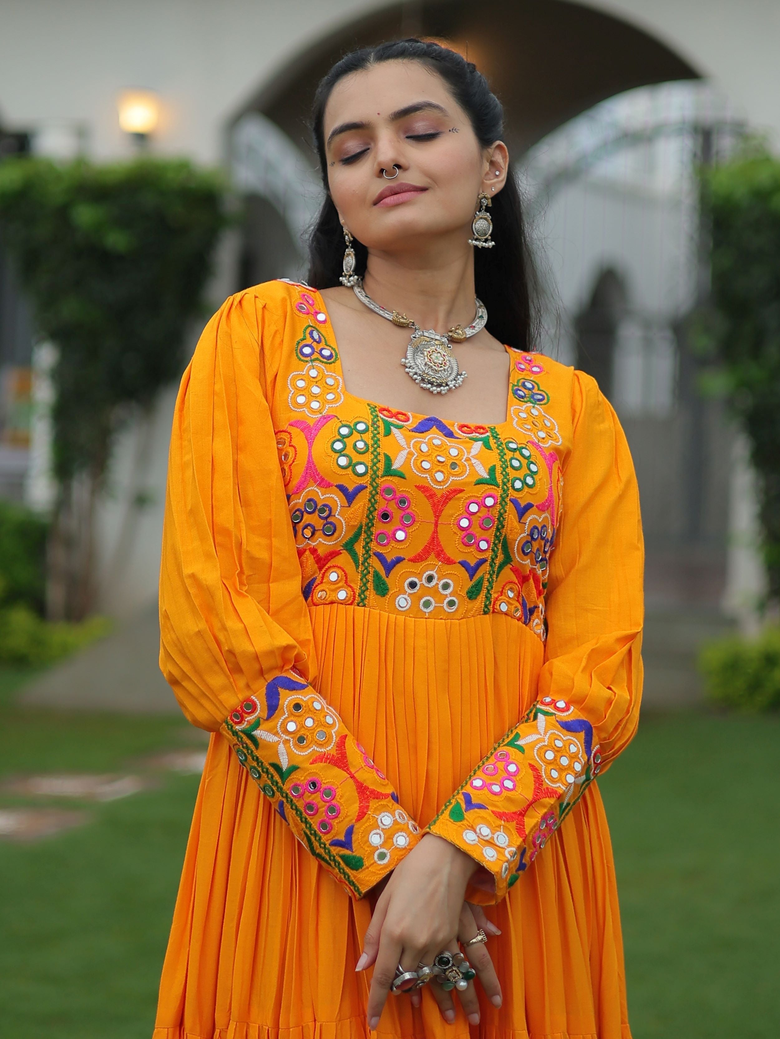 Yellow rayon flair gown with kutchi gamthi work for navratri