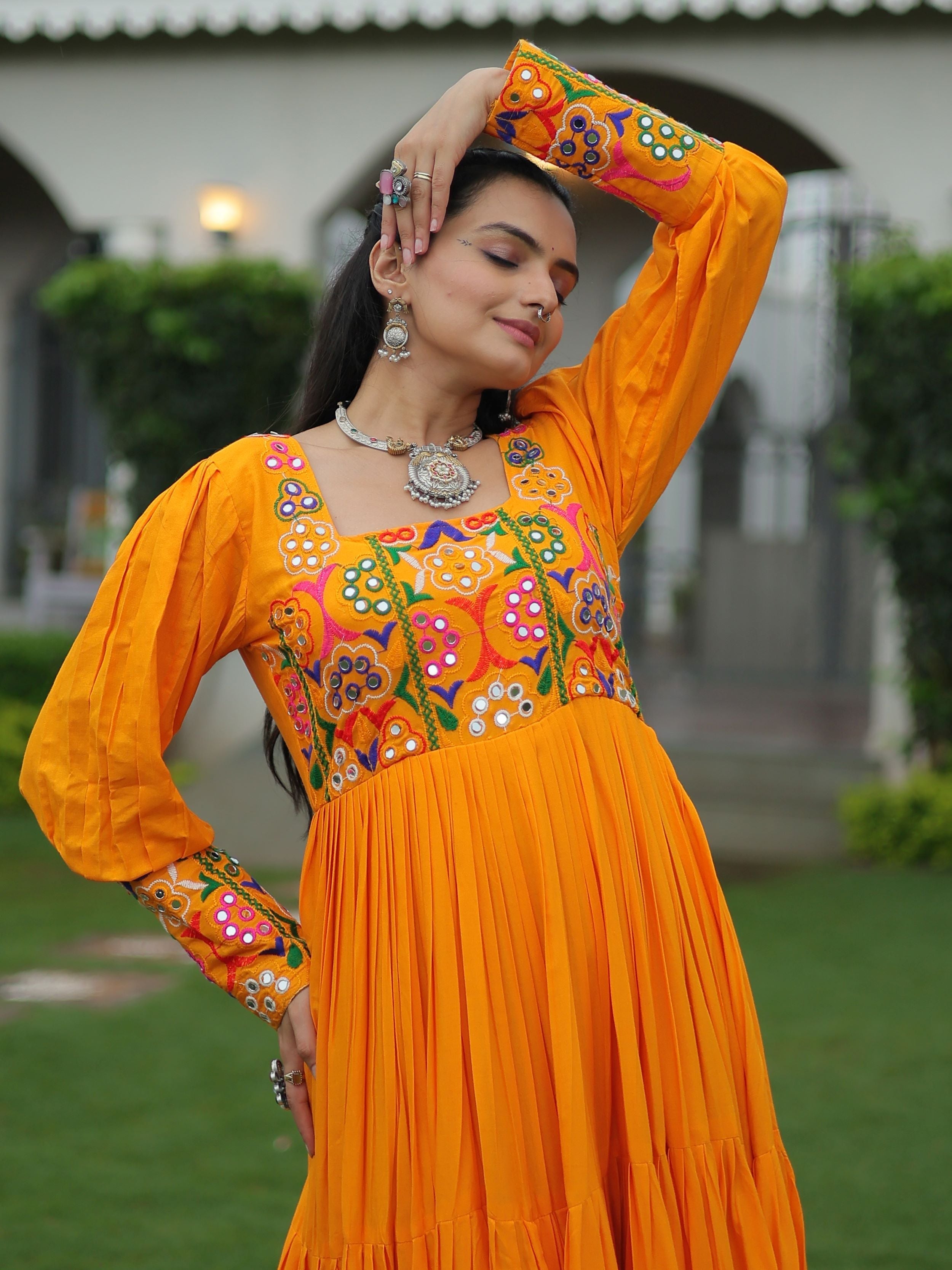 Yellow rayon flair gown with kutchi gamthi work for navratri