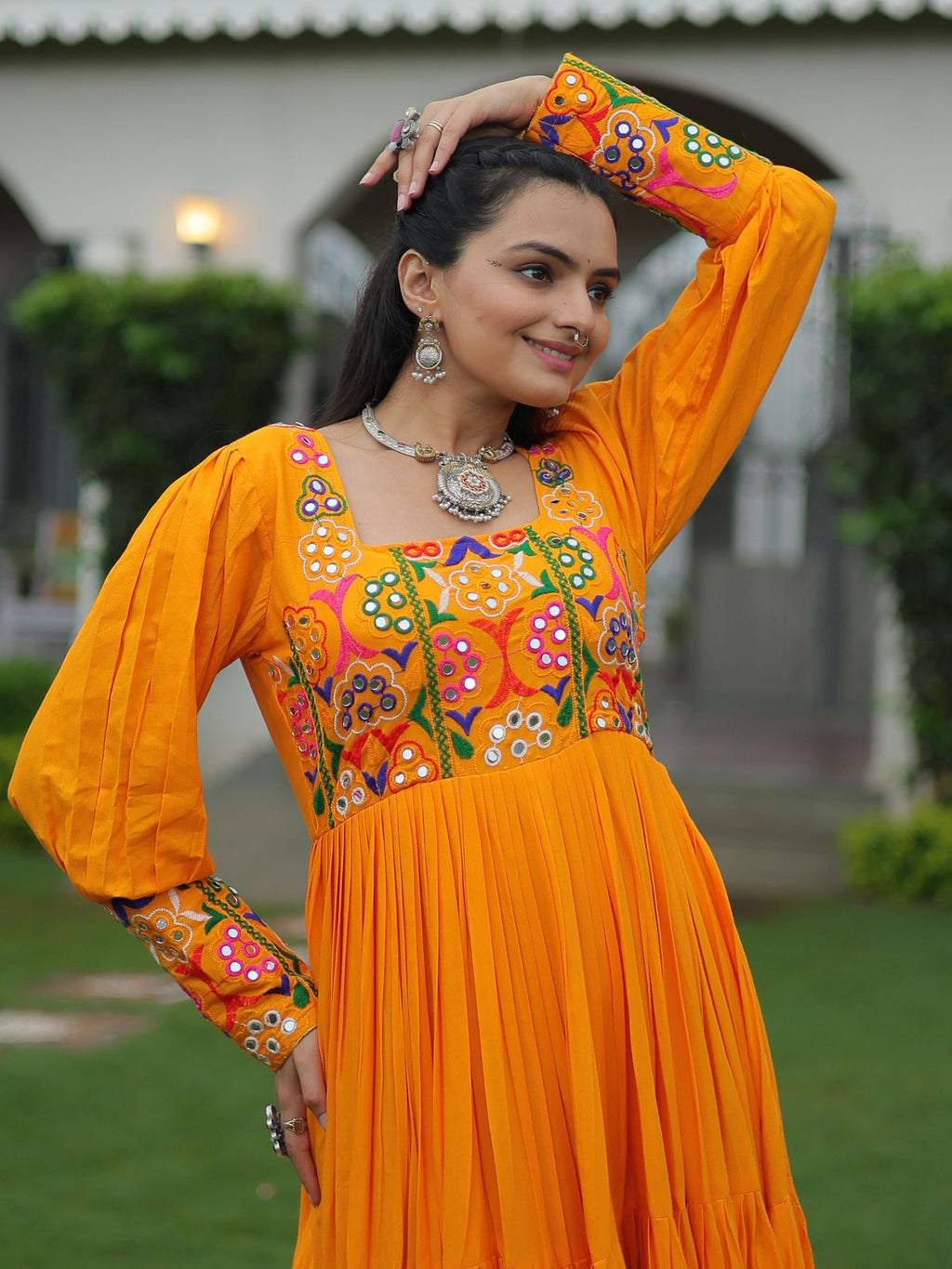 Yellow rayon flair gown with kutchi gamthi work for navratri