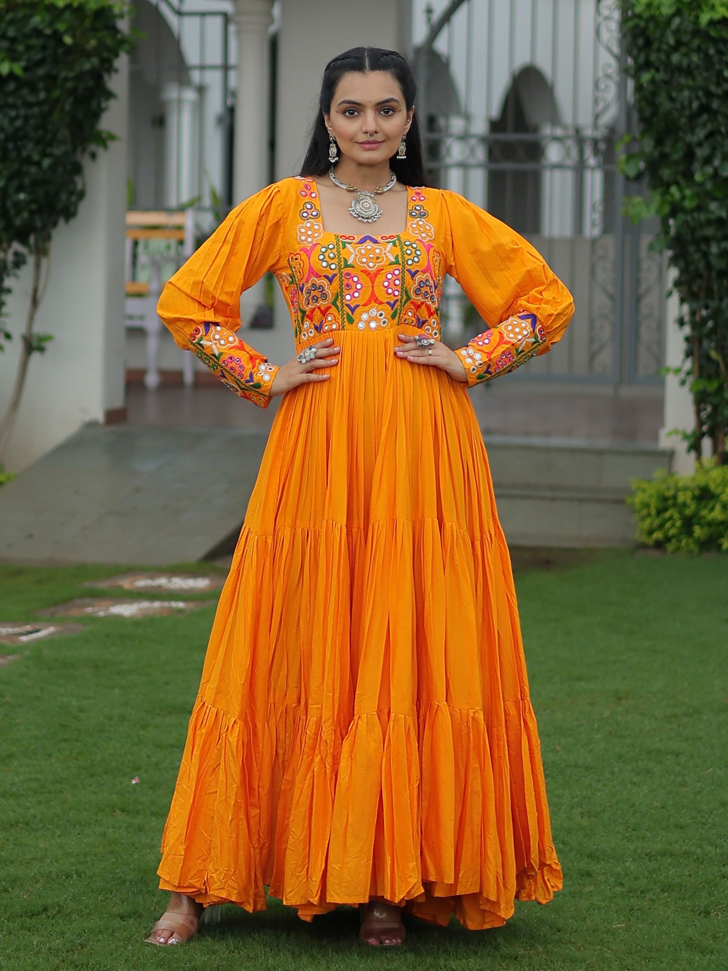 Yellow rayon flair gown with kutchi gamthi work for navratri