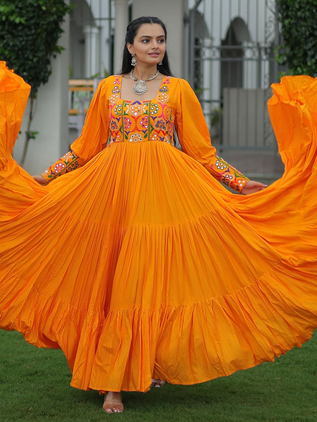 Yellow rayon flair gown with kutchi gamthi work for navratri