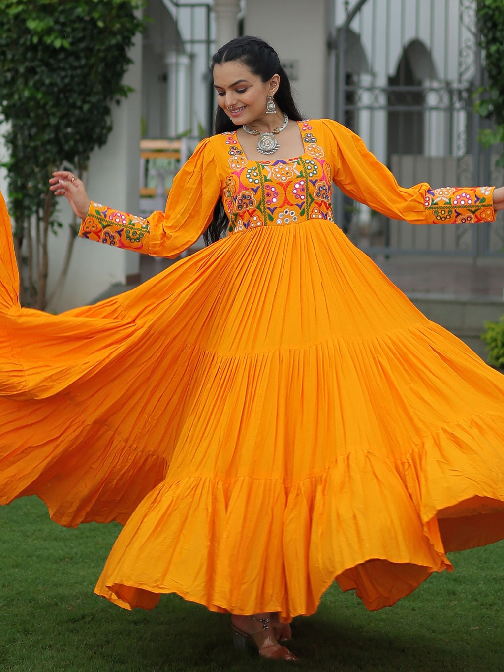 Yellow rayon flair gown with kutchi gamthi work for navratri