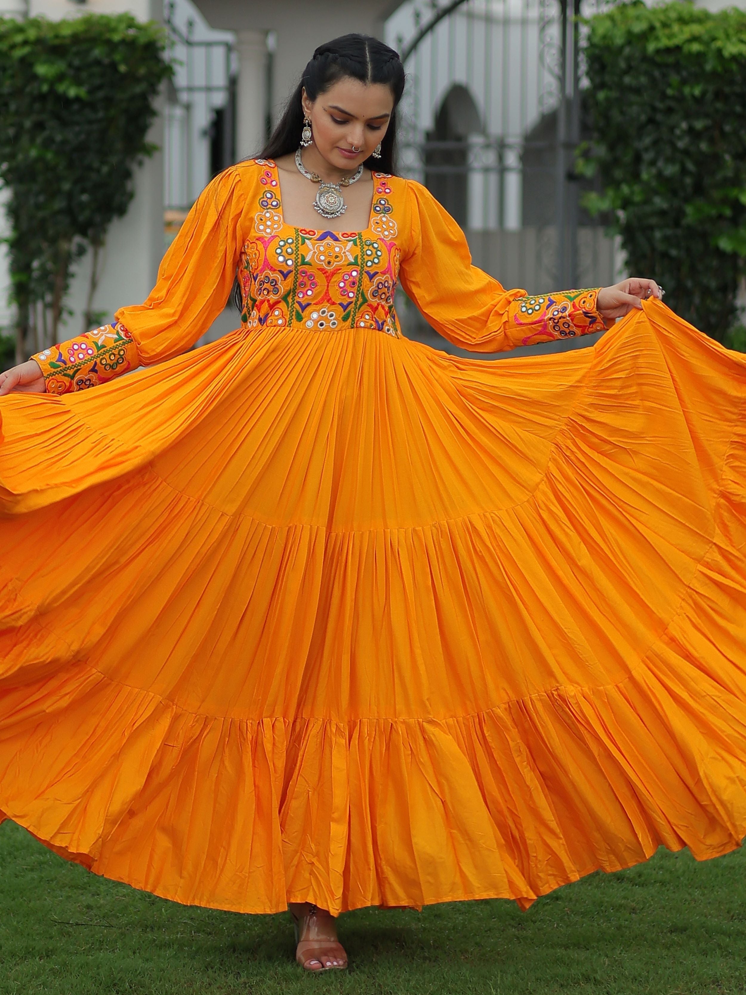 Yellow rayon flair gown with kutchi gamthi work for navratri