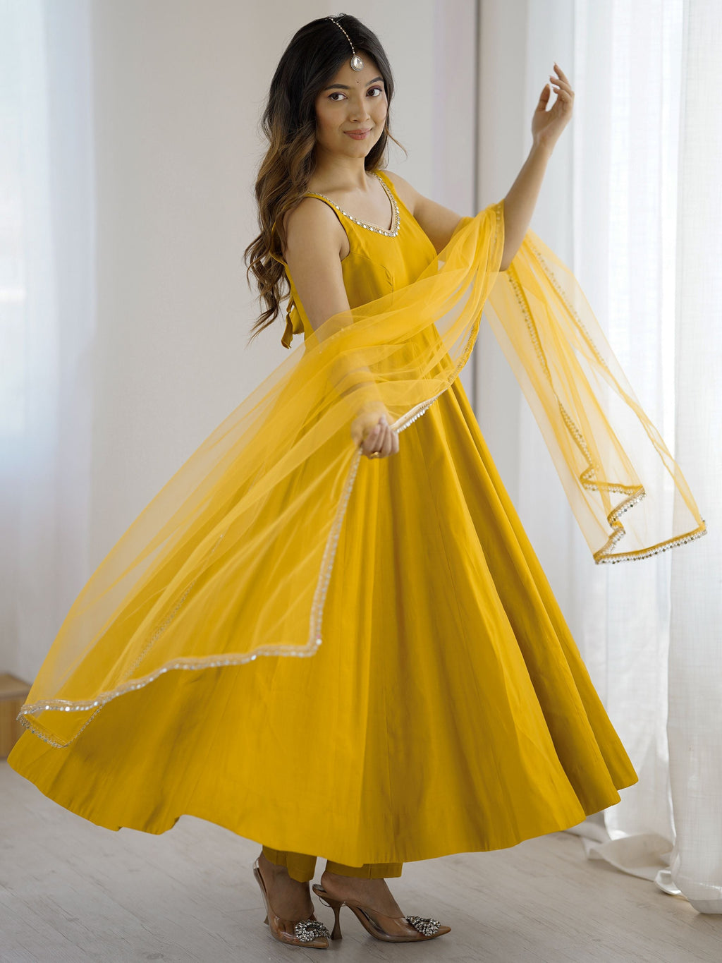 Yellow silk Anarkali suit with mirror lace work and dupatta