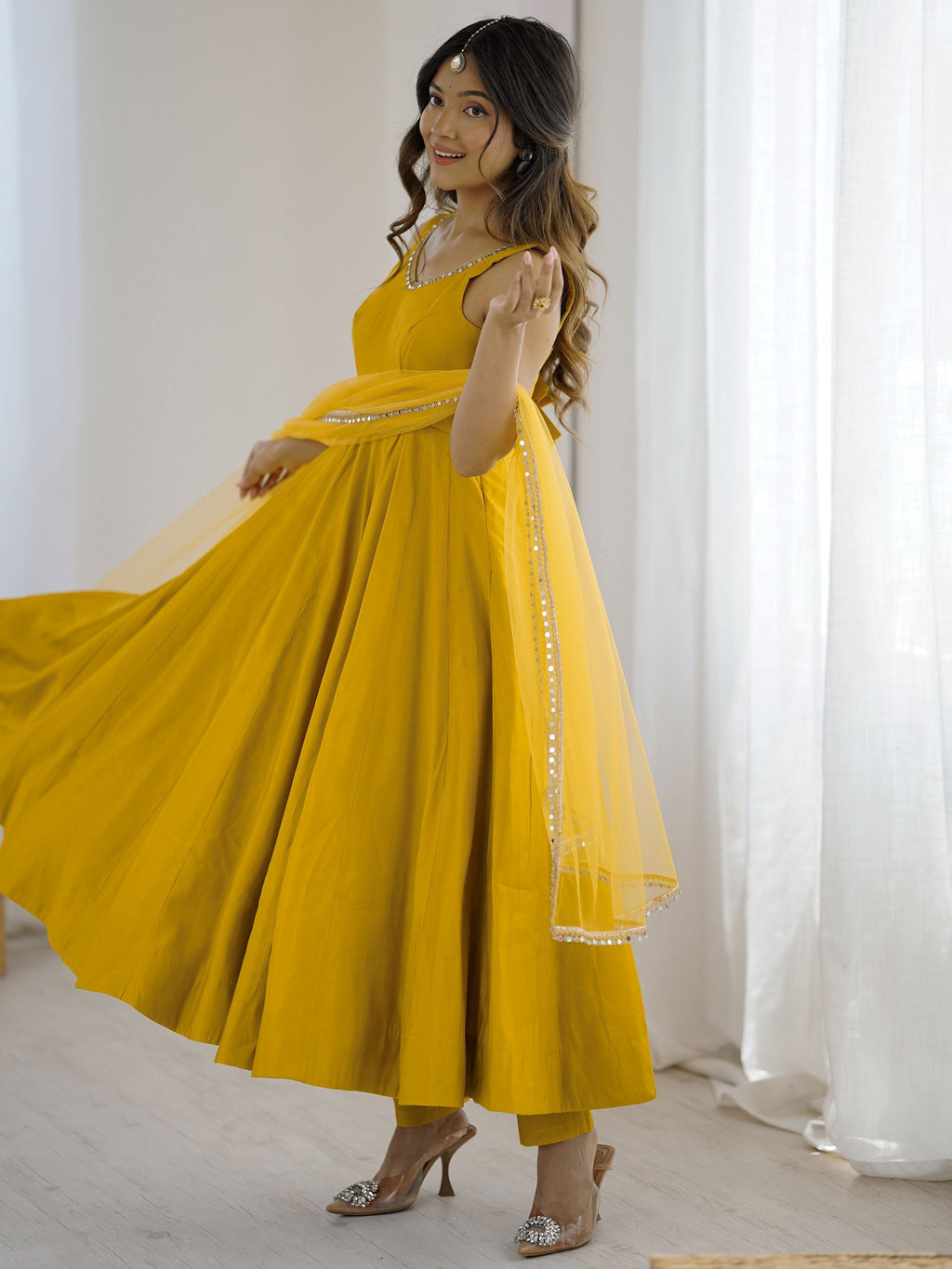 Yellow silk Anarkali suit with mirror lace work and dupatta