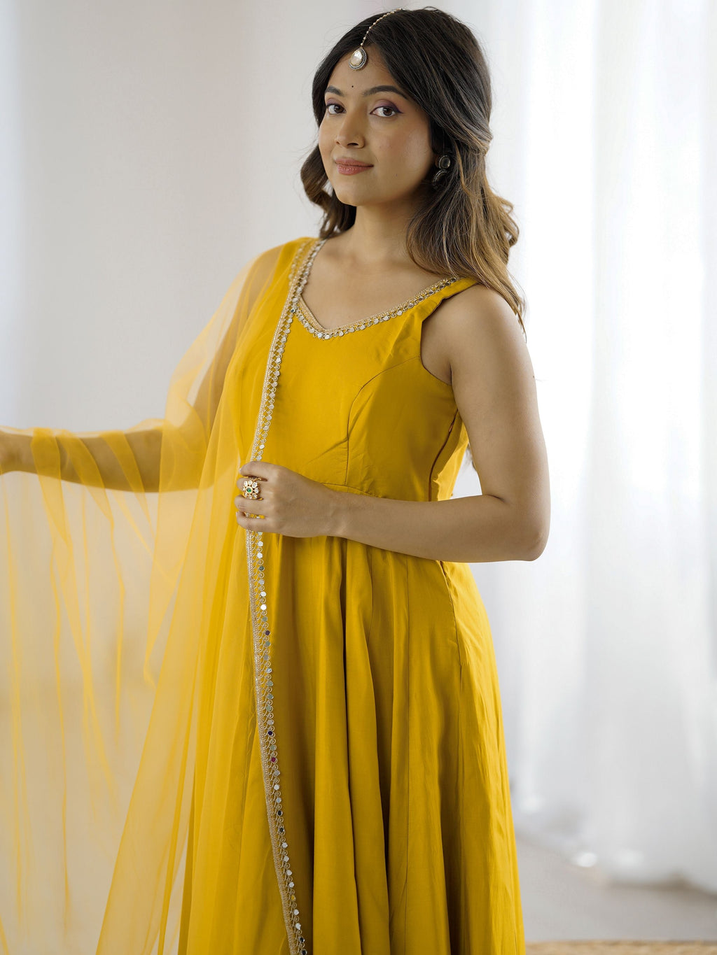 Yellow silk Anarkali suit with mirror lace work and dupatta