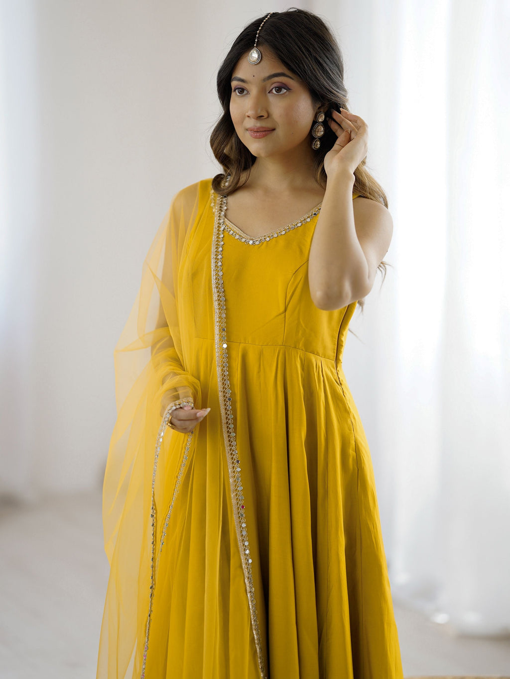 Yellow silk Anarkali suit with mirror lace work and dupatta