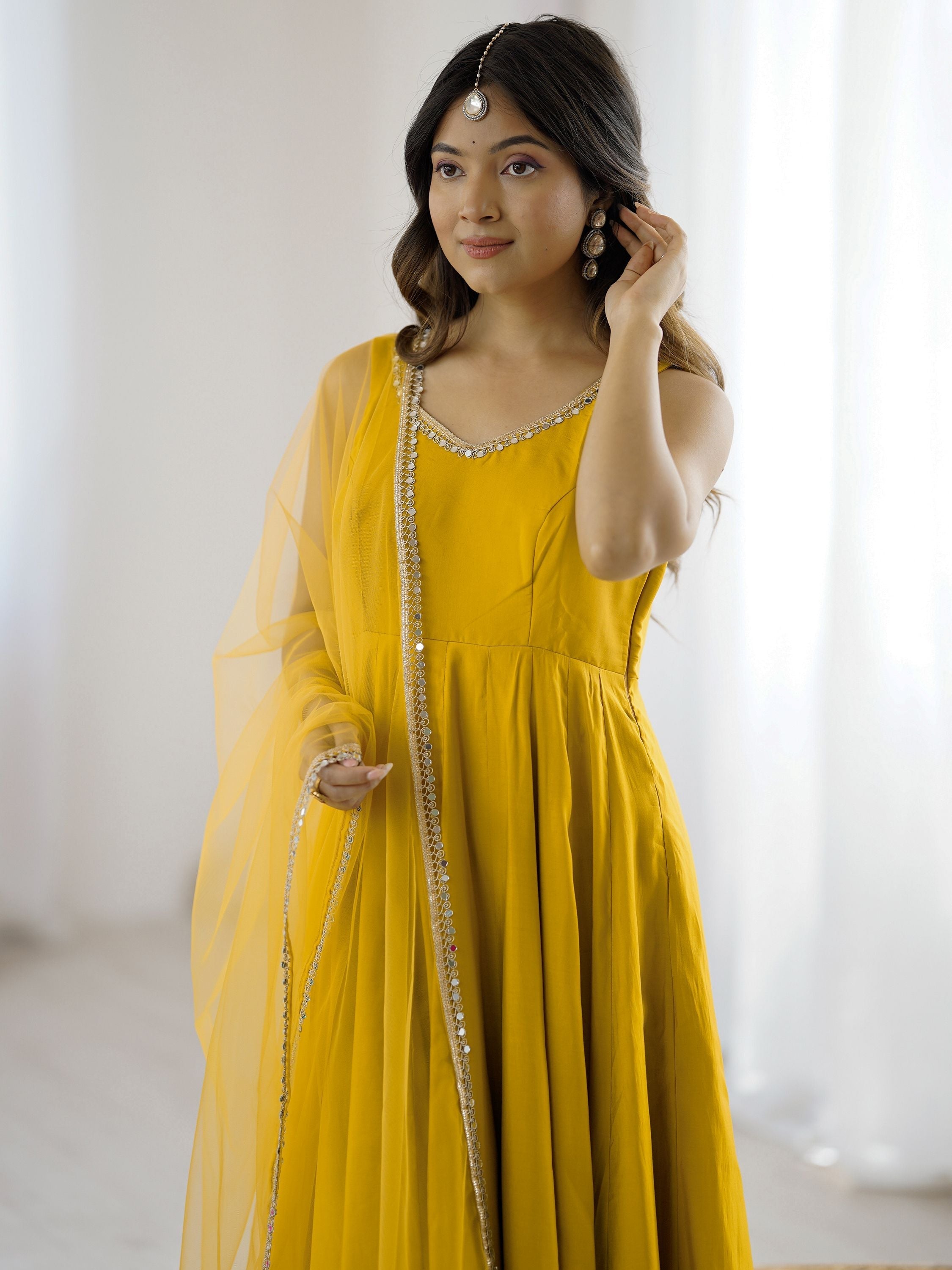 Yellow silk Anarkali suit with mirror lace work and dupatta