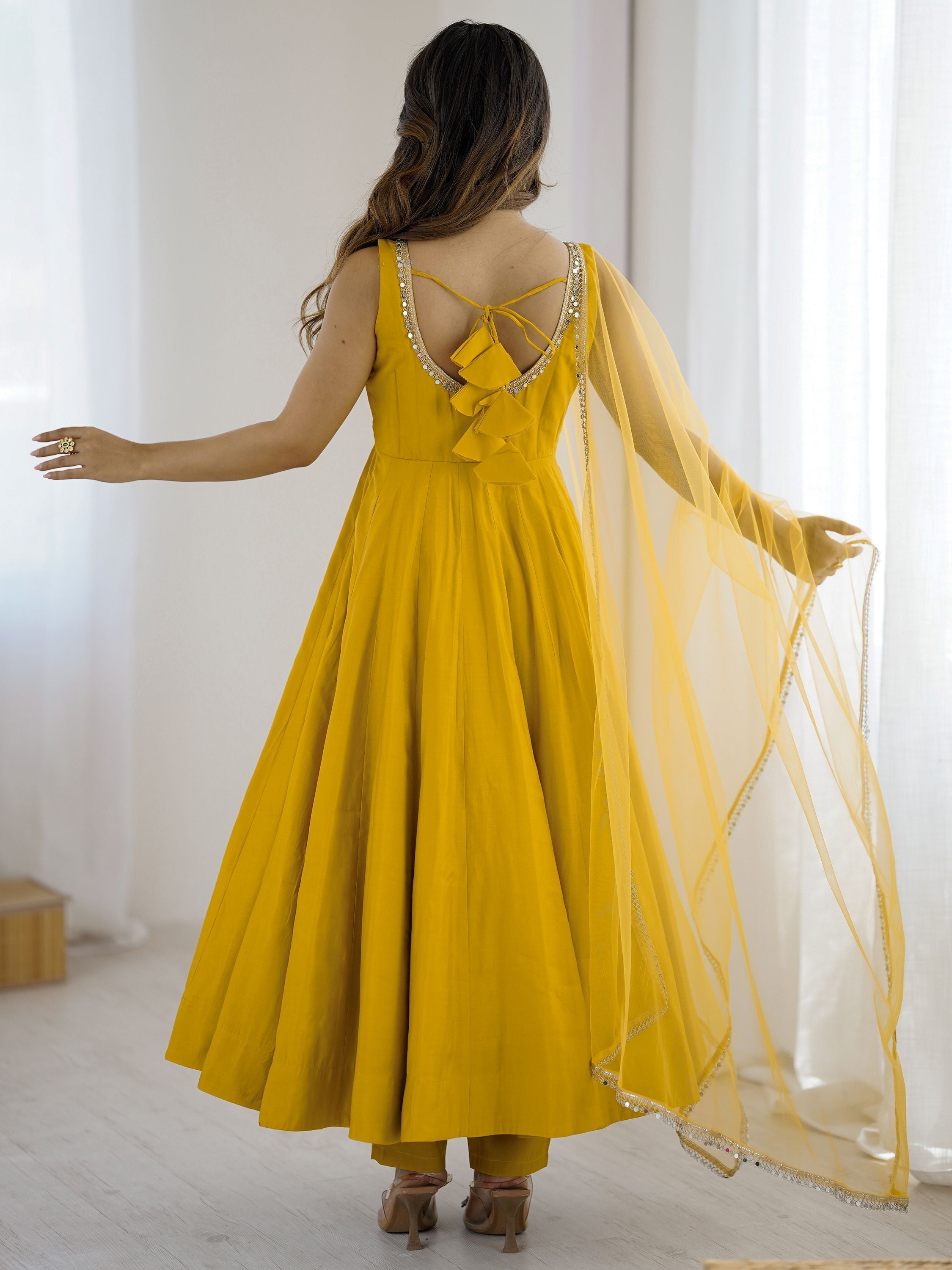 Yellow silk Anarkali suit with mirror lace work and dupatta
