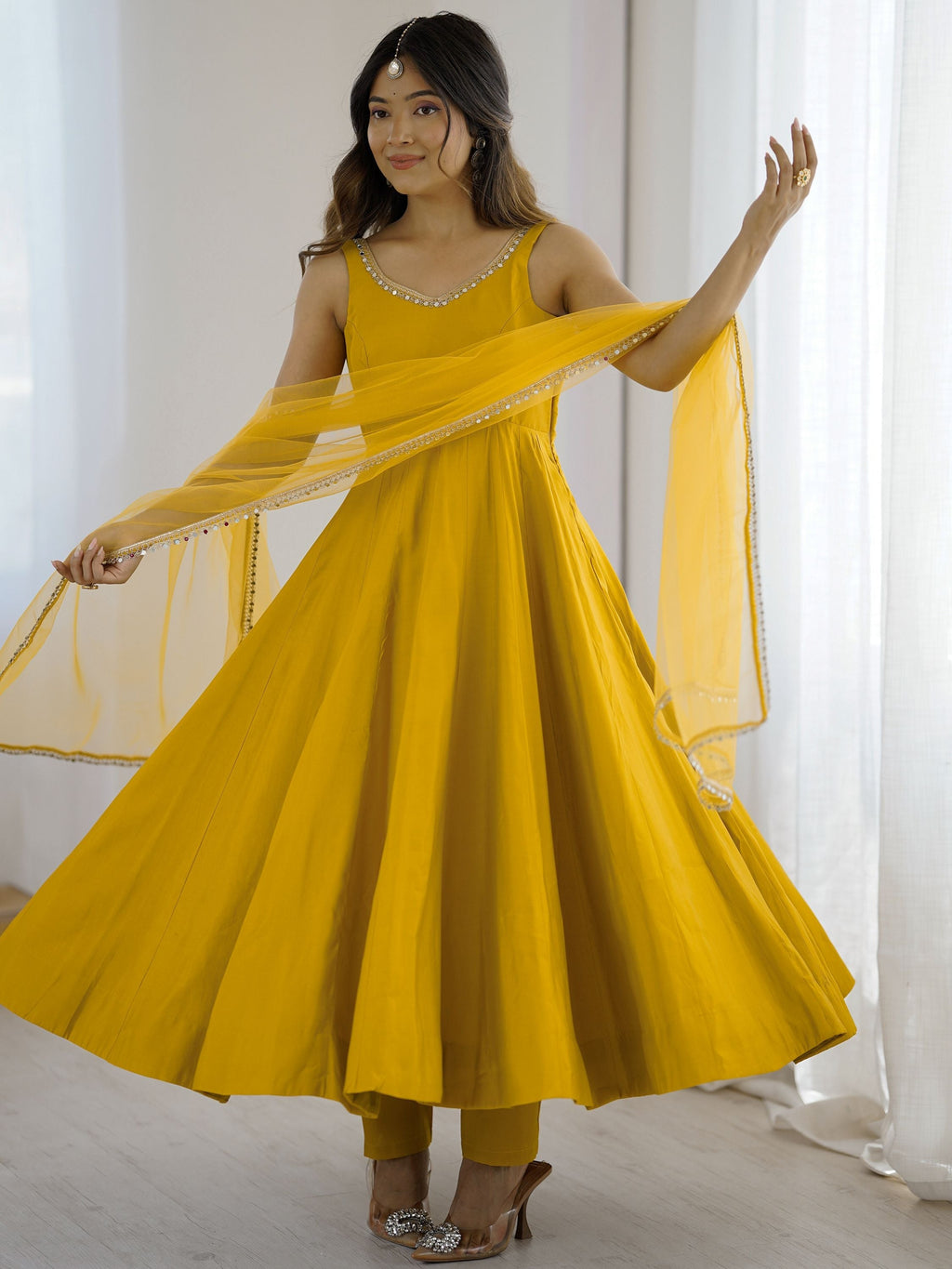 Yellow silk Anarkali suit with mirror lace work and dupatta