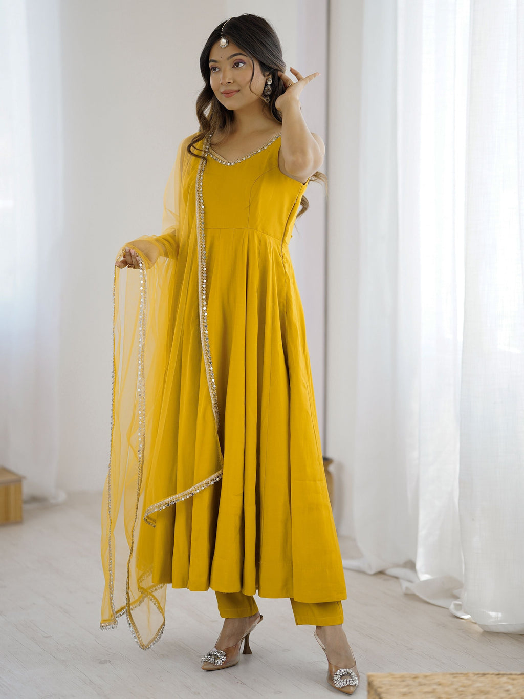 Yellow silk Anarkali suit with mirror lace work and dupatta