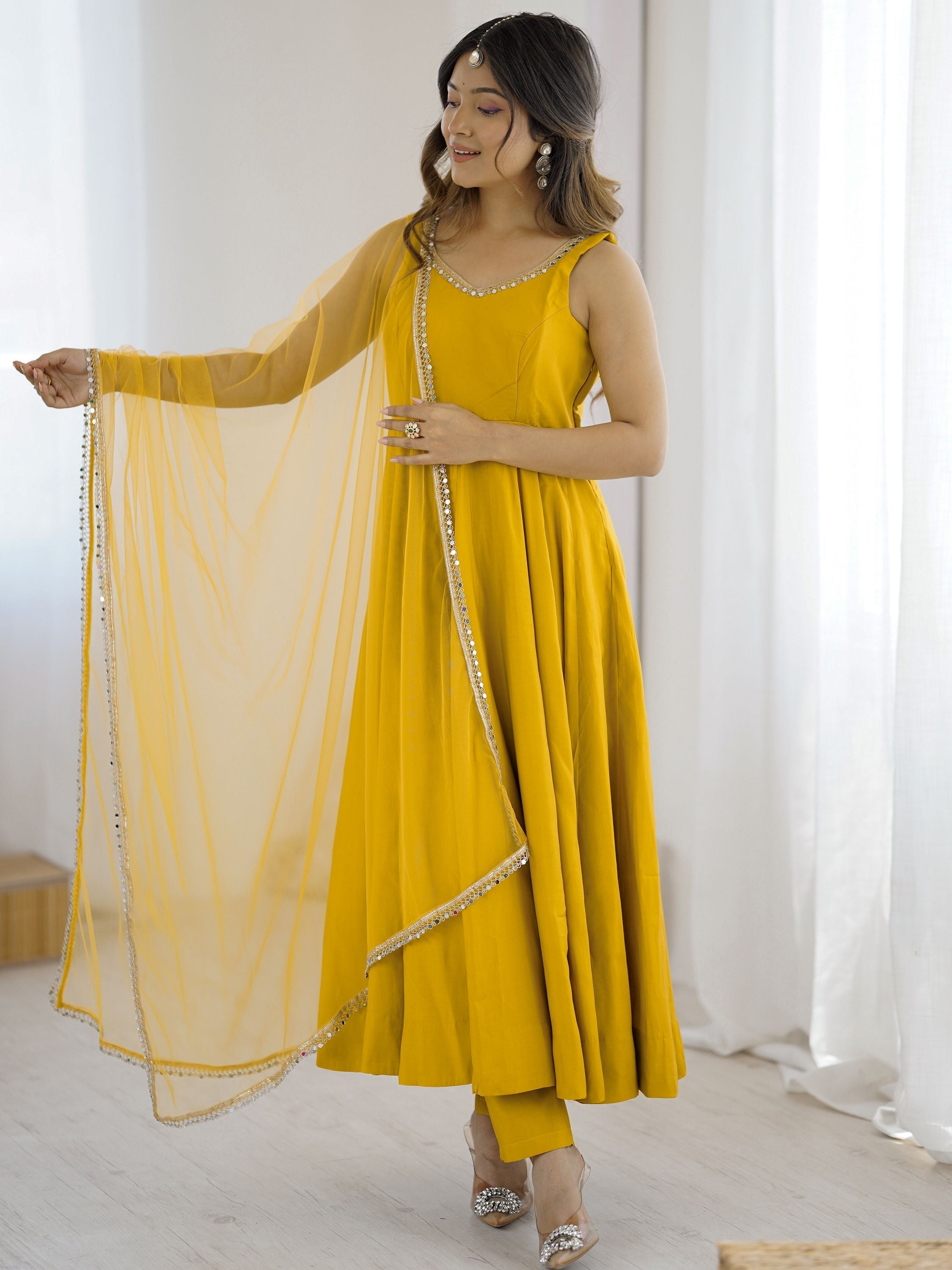 Yellow silk Anarkali suit with mirror lace work and dupatta