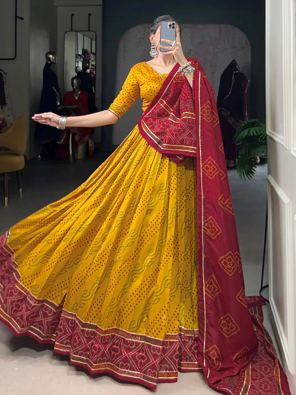Yellow silk lehenga choli with Bandhani print and Gotta Patti lace