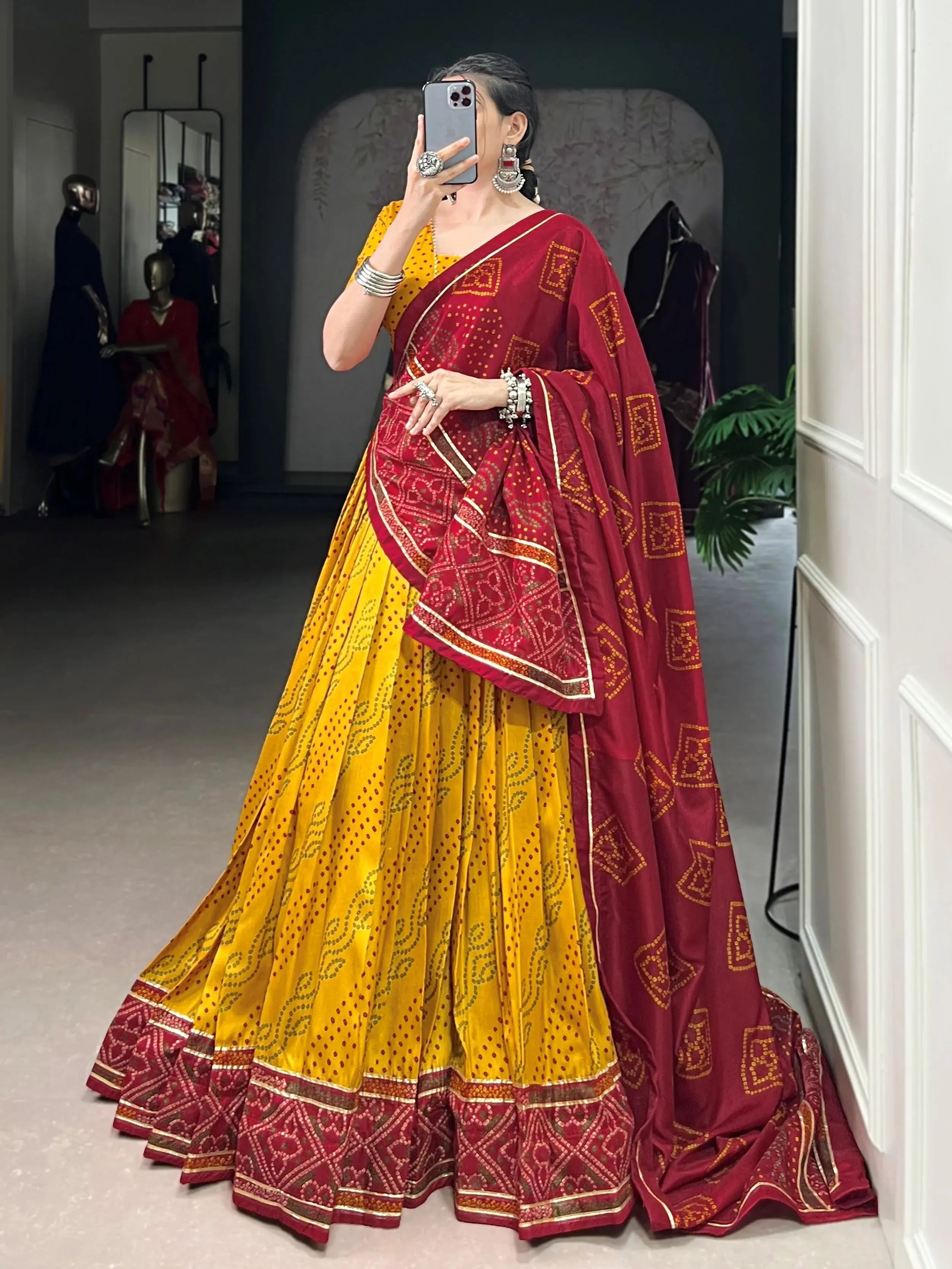 Yellow silk lehenga choli with Bandhani print and Gotta Patti lace