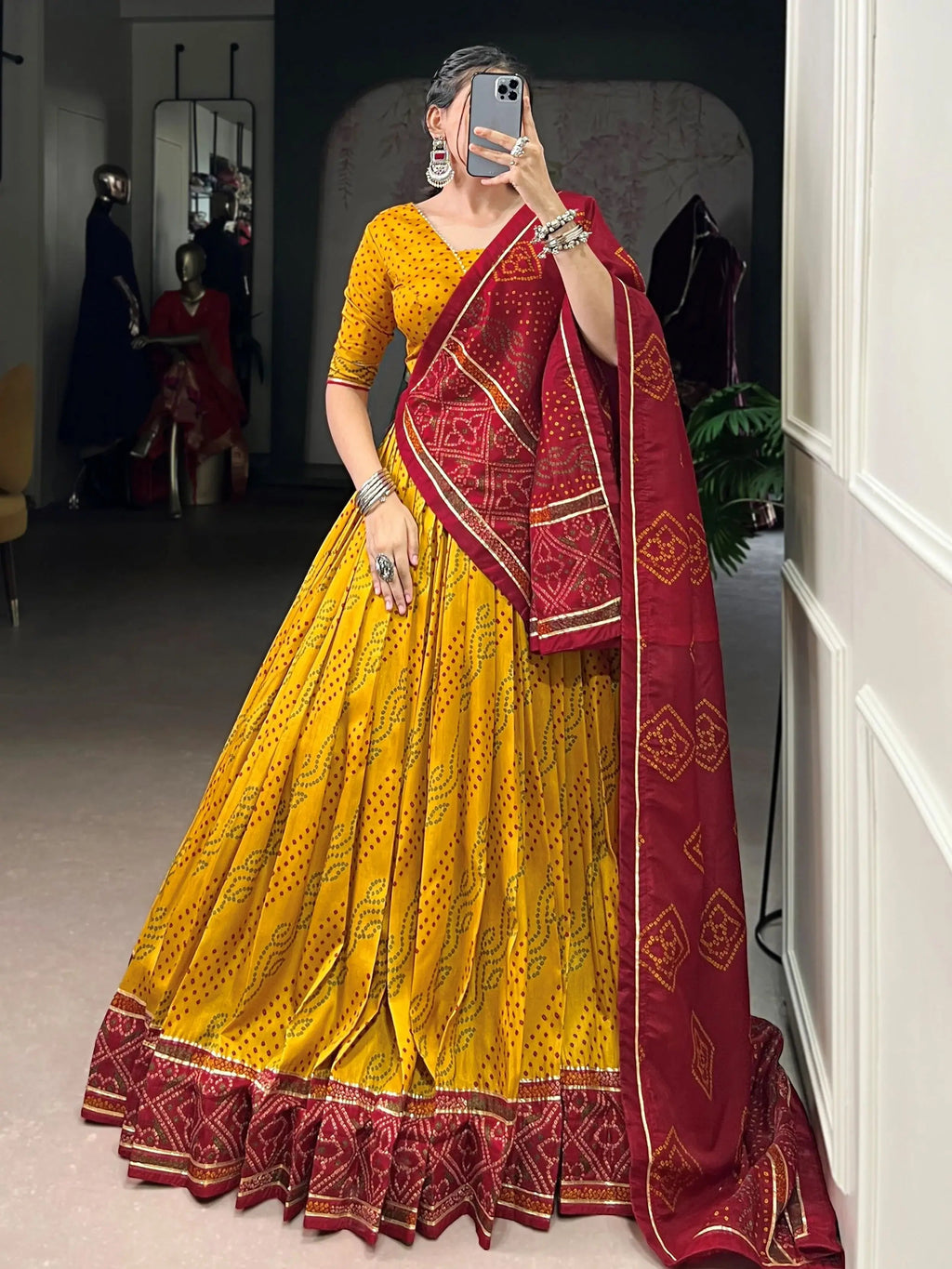 Yellow silk lehenga choli with Bandhani print and Gotta Patti lace