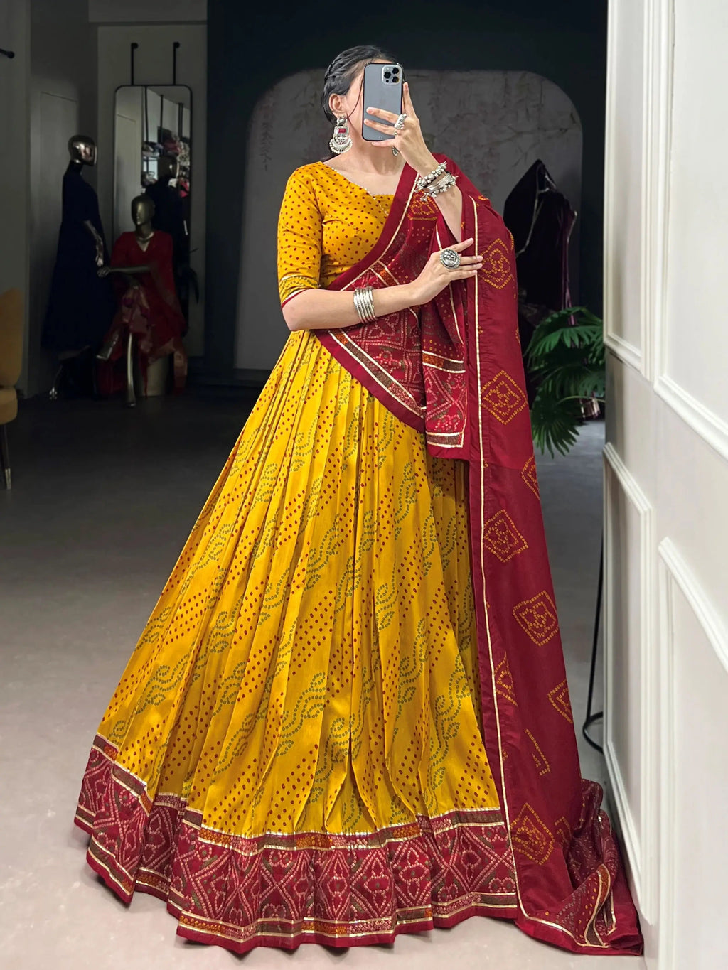 Yellow silk lehenga choli with Bandhani print and Gotta Patti lace