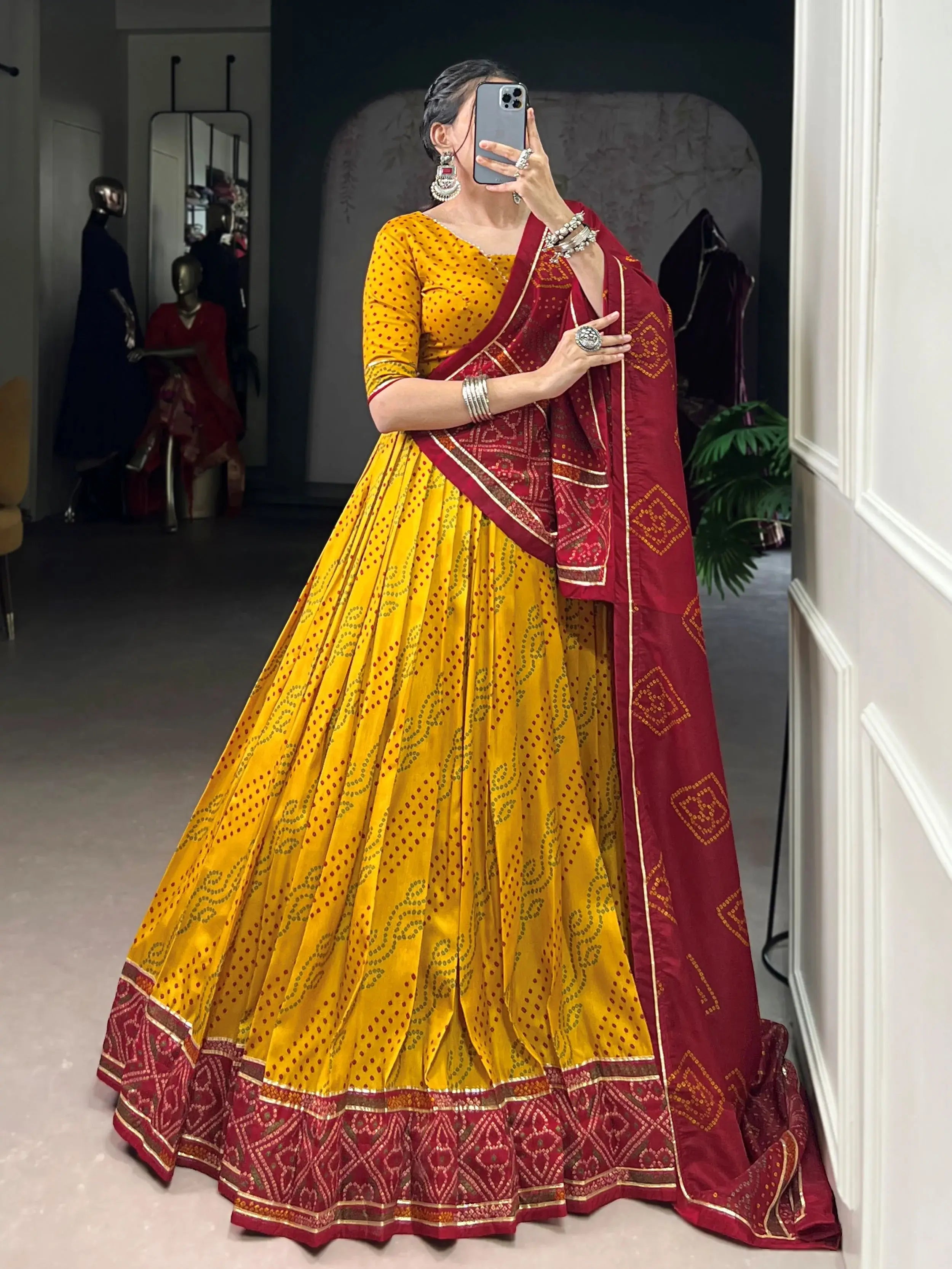Yellow silk lehenga choli with Bandhani print and Gotta Patti lace