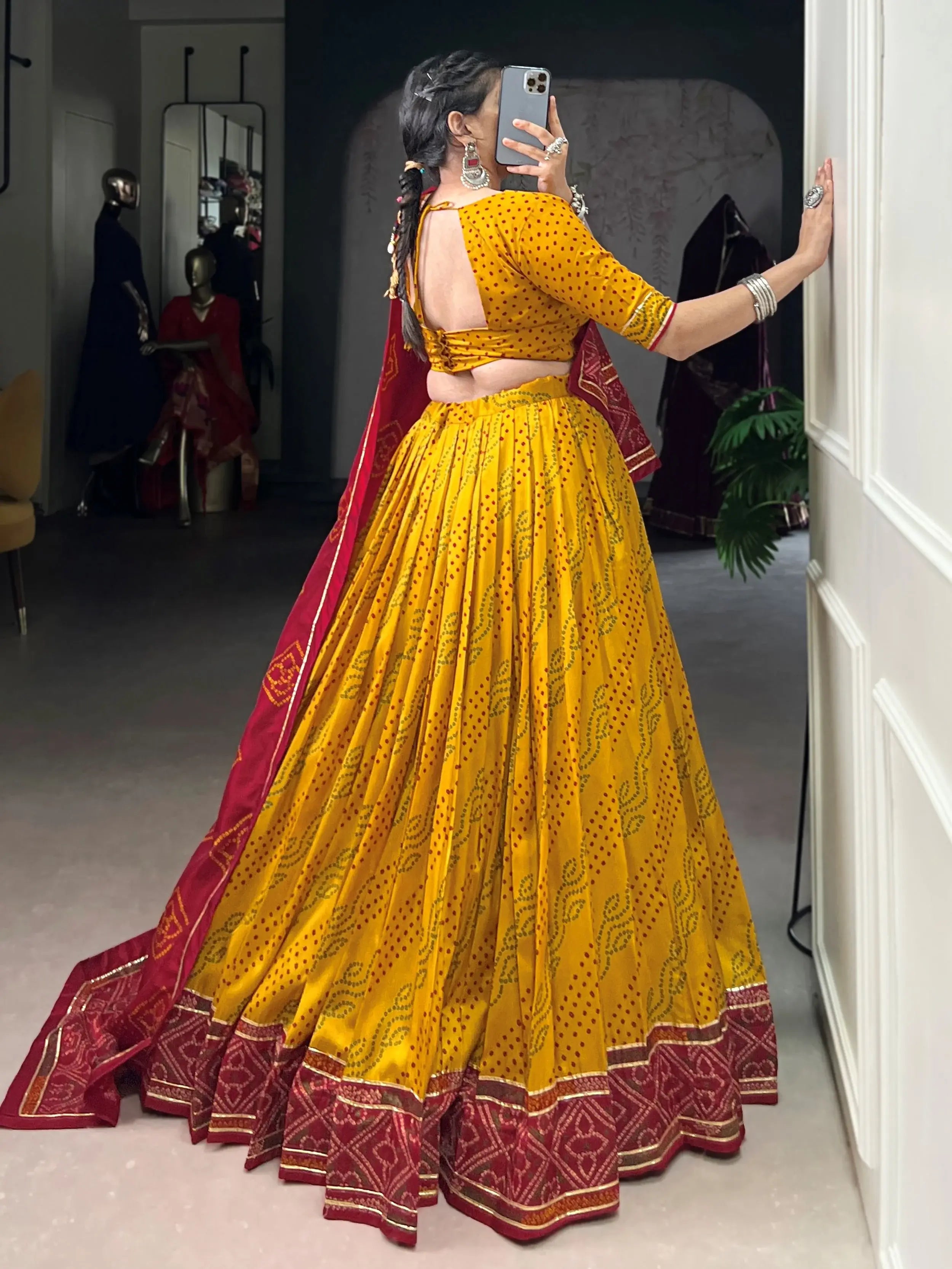 Yellow silk lehenga choli with Bandhani print and Gotta Patti lace