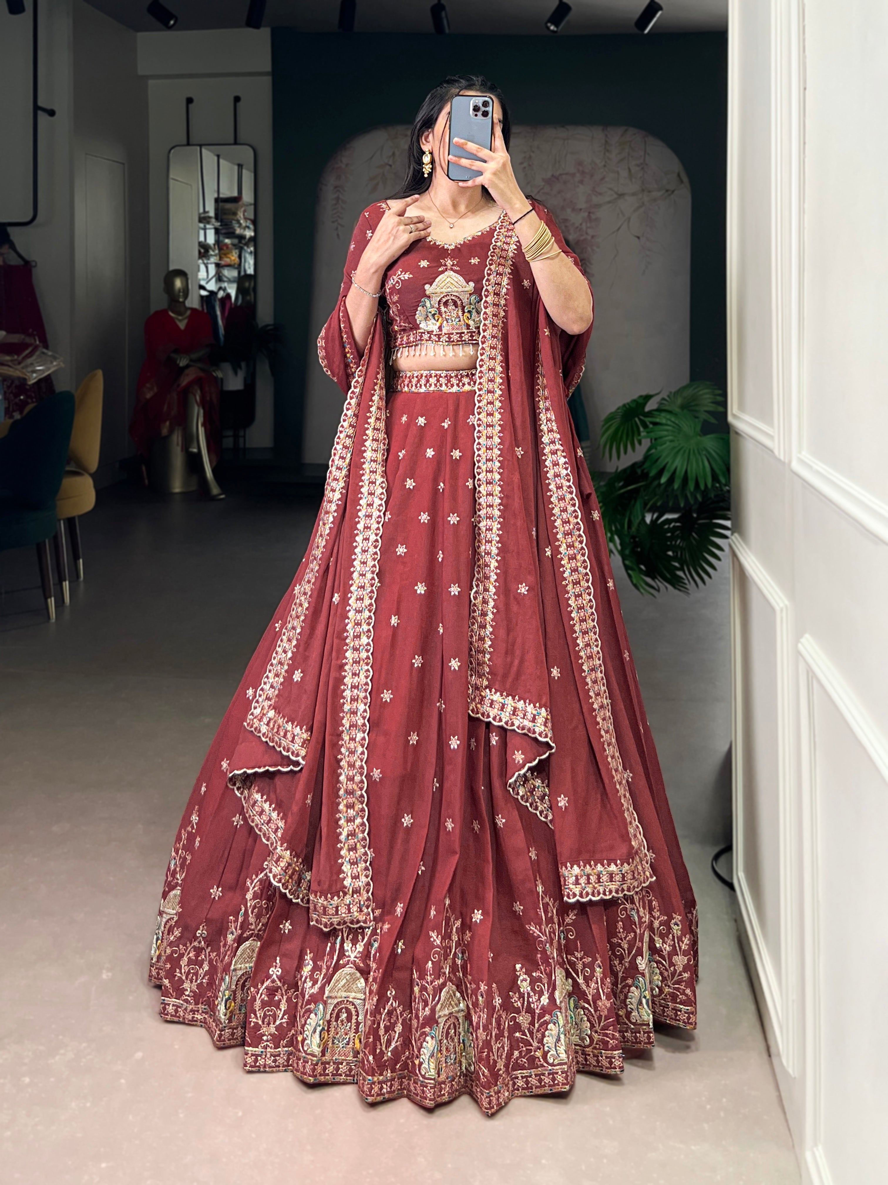 Zarakh rust maroon silk lehenga choli with sequins and thread embroidery