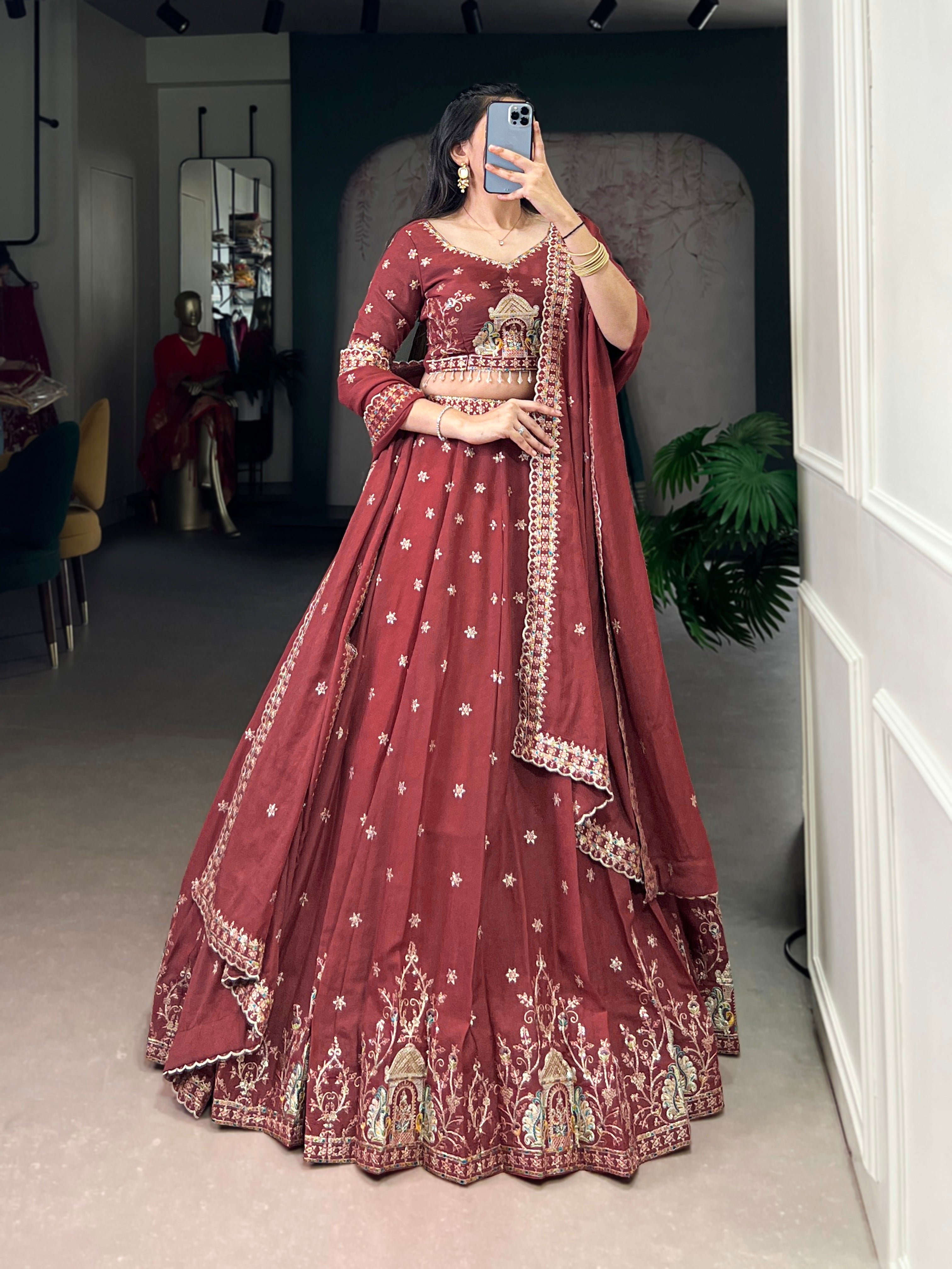 Zarakh rust maroon silk lehenga choli with sequins and thread embroidery